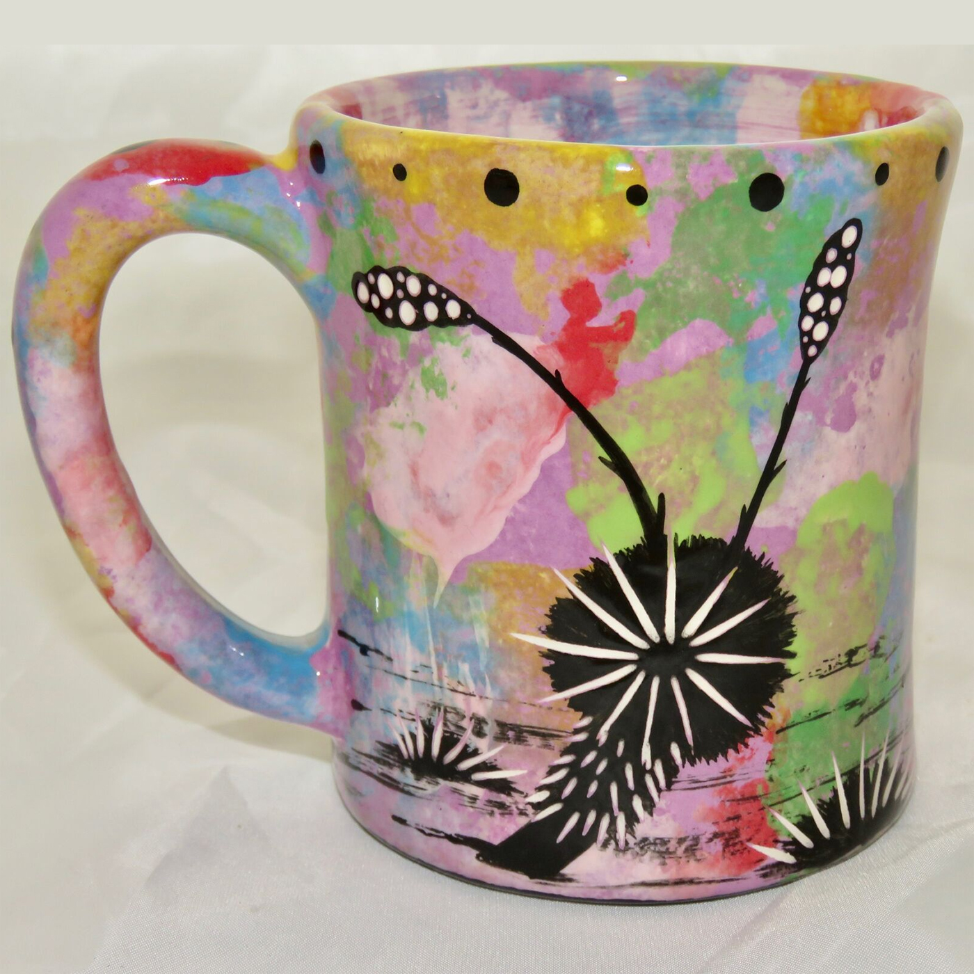 Ear handle mug, rabbit, purple background. This is the reverse side showing Aravaipa vegetation.