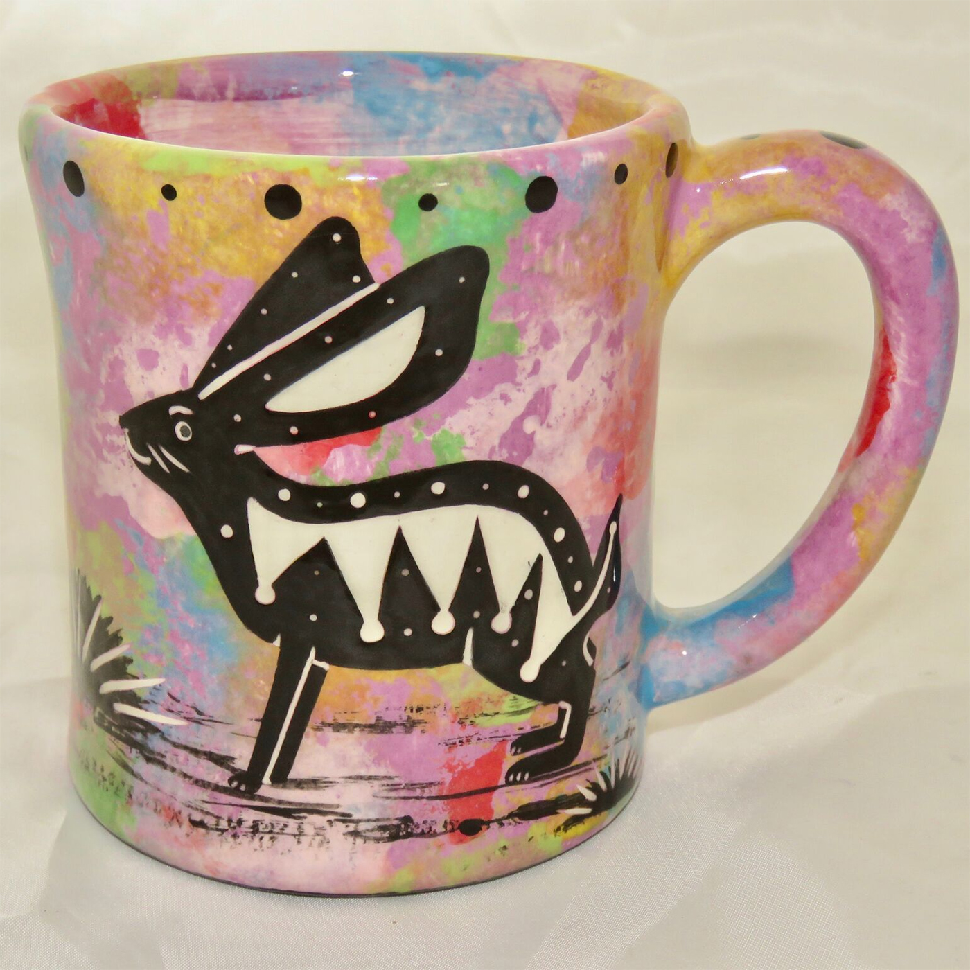 Ear handle mug, rabbit, purple background.