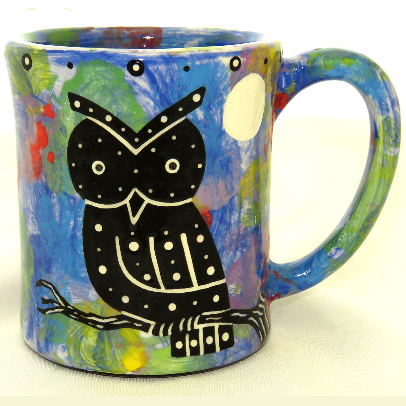 Ear-shaped handle mug with owl on blue