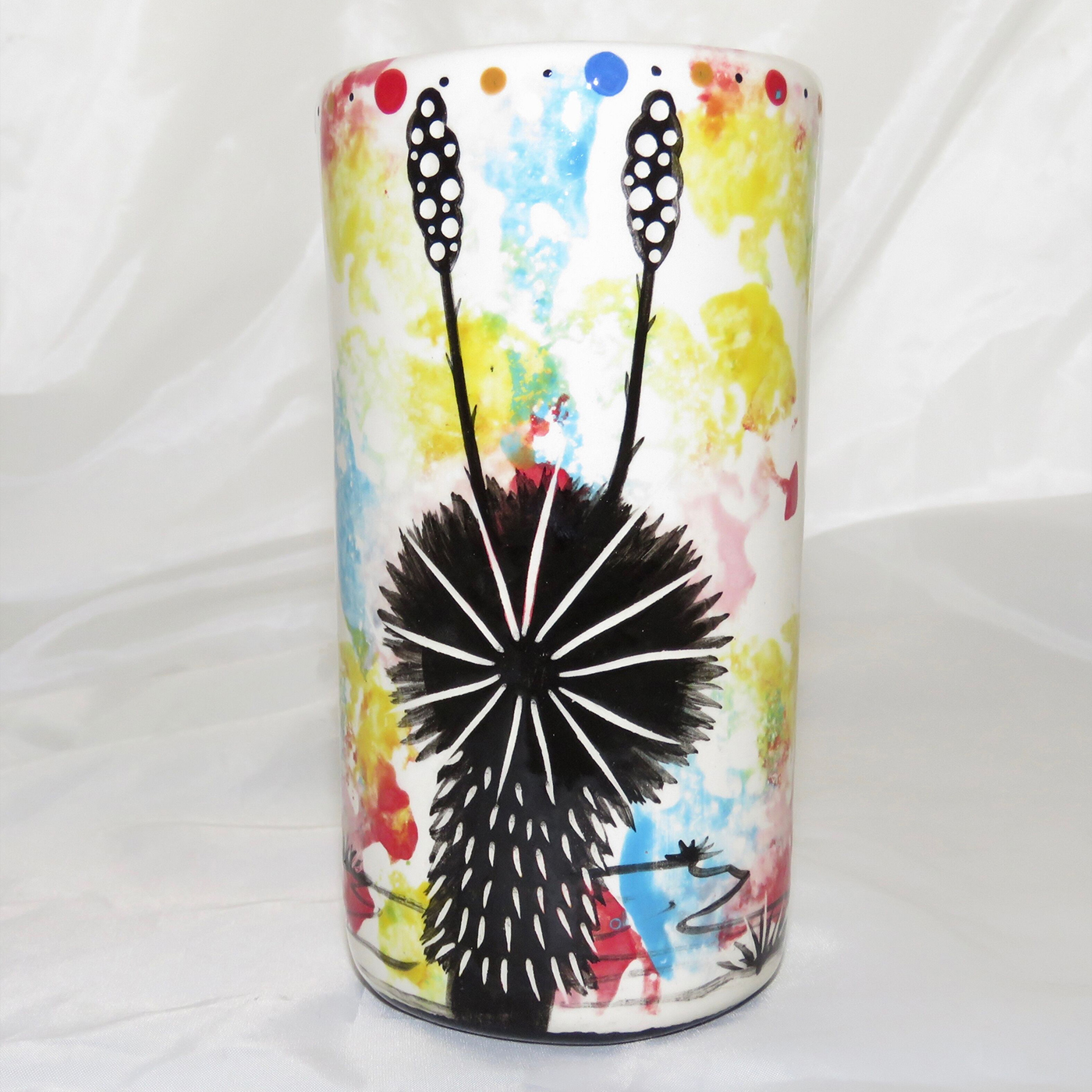 Mana Pottery clay shot glass featuring Peyote root on one side and native Aravaipa vegetation on reverse. Image shows reverse side.