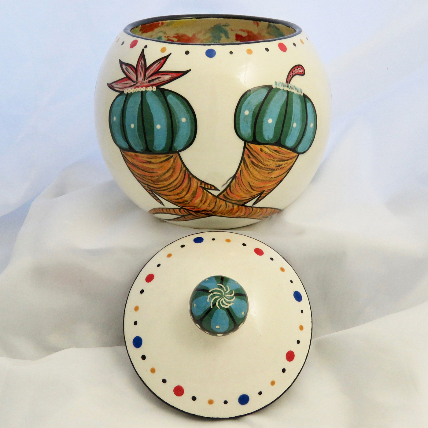 Mana Pottery canister with Peyote roots on one side and Firebird on reverse and confetti interior. Without lid.