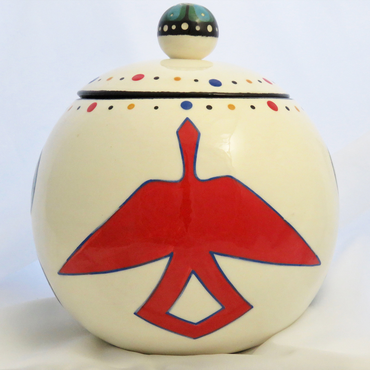Mana Pottery canister with Peyote roots on one side and Firebird on reverse and confetti interior.