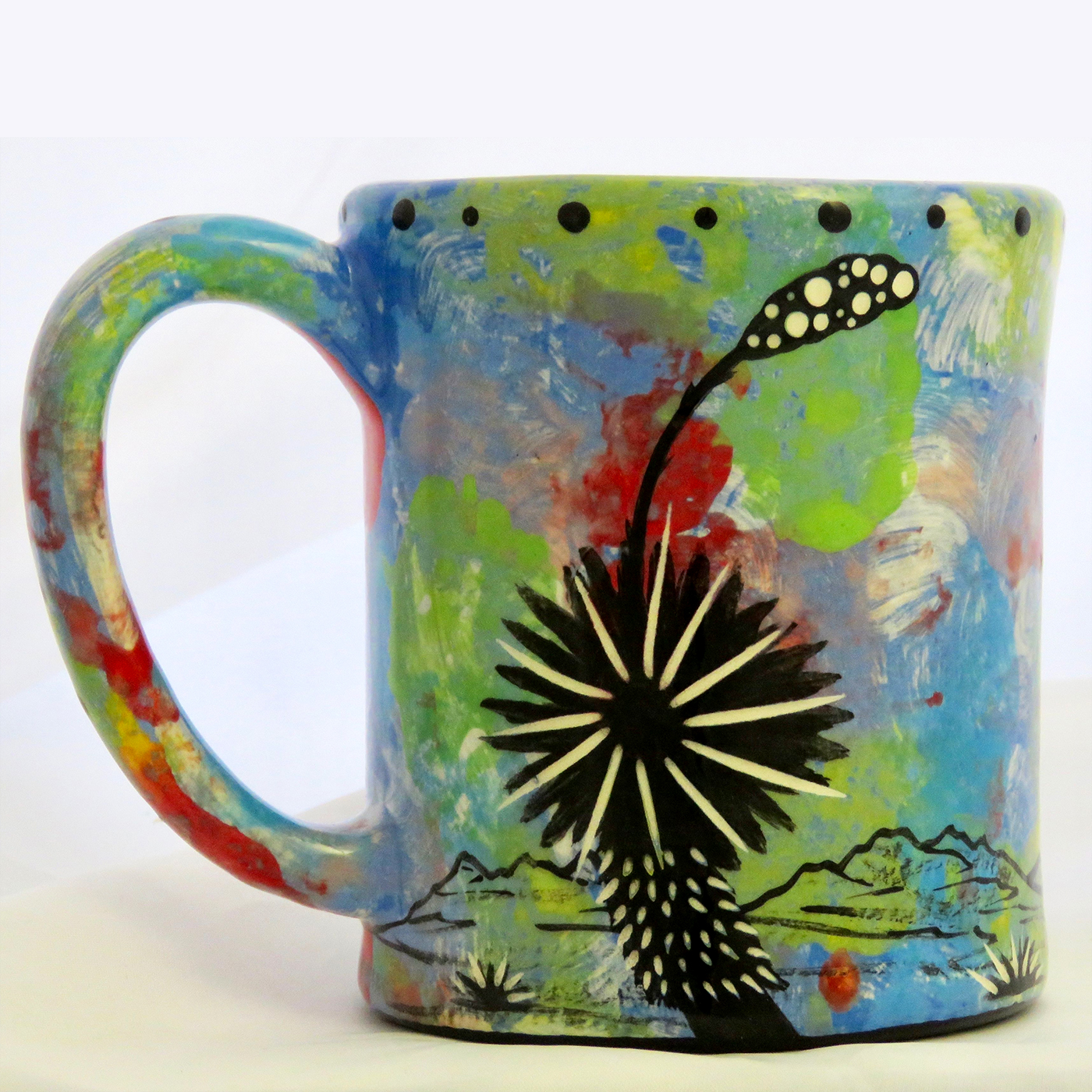 Mana Pottery e-mug with hawk on blue background. Reverse side shows Aravaipa desert vegetation.