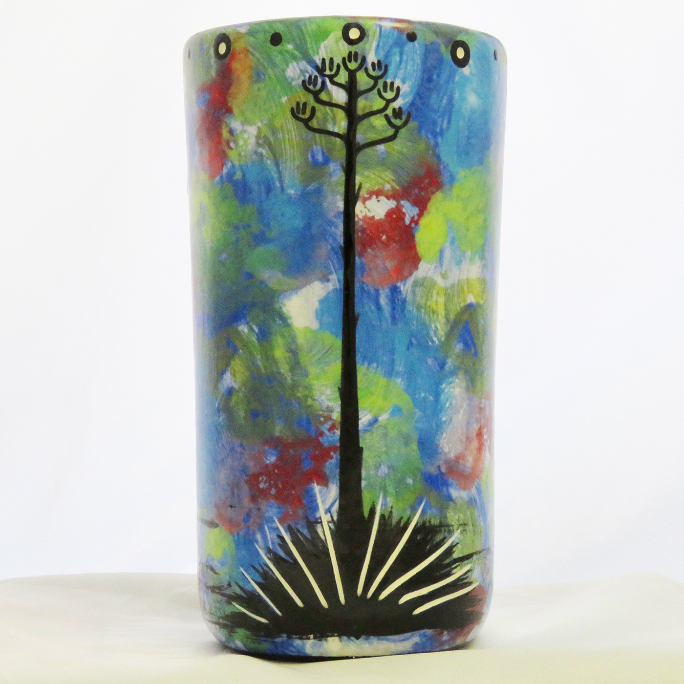 Reverse side of Mana Pottery bear and cub tumbler showing Aravaipa vegetation