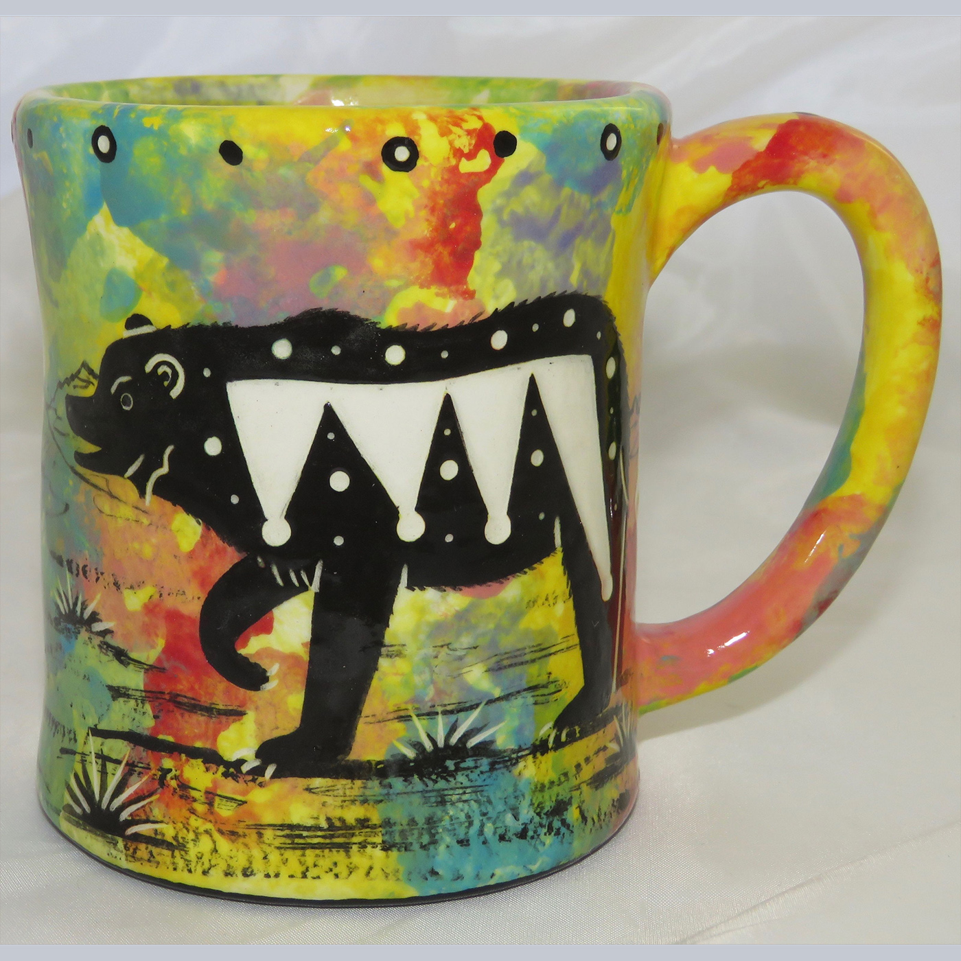 Mana Pottery e-mug featuring bear on one side and native Aravaipa vegetation on reverse, on bright yellow background.