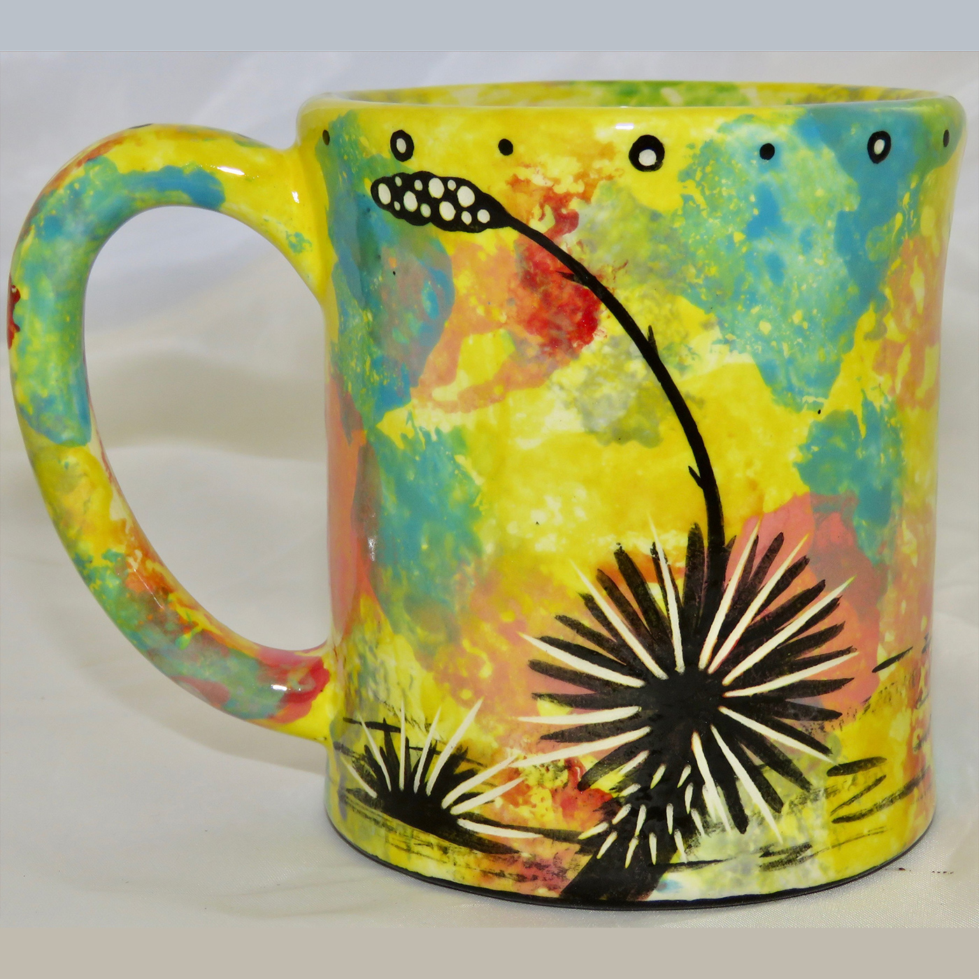 Mana Pottery e-mug featuring rabbit on one side and native Aravaipa vegetation on reverse, on yellow background.