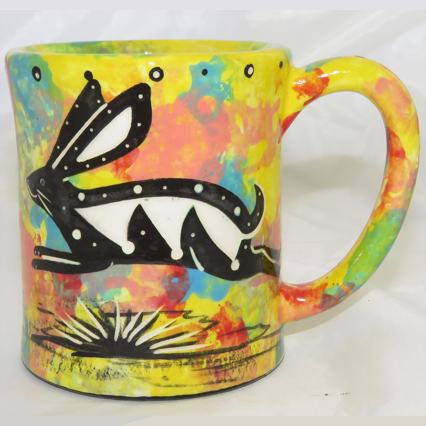 Mana Pottery e-mug featuring rabbit on one side and native Aravaipa vegetation on reverse, on yellow background.