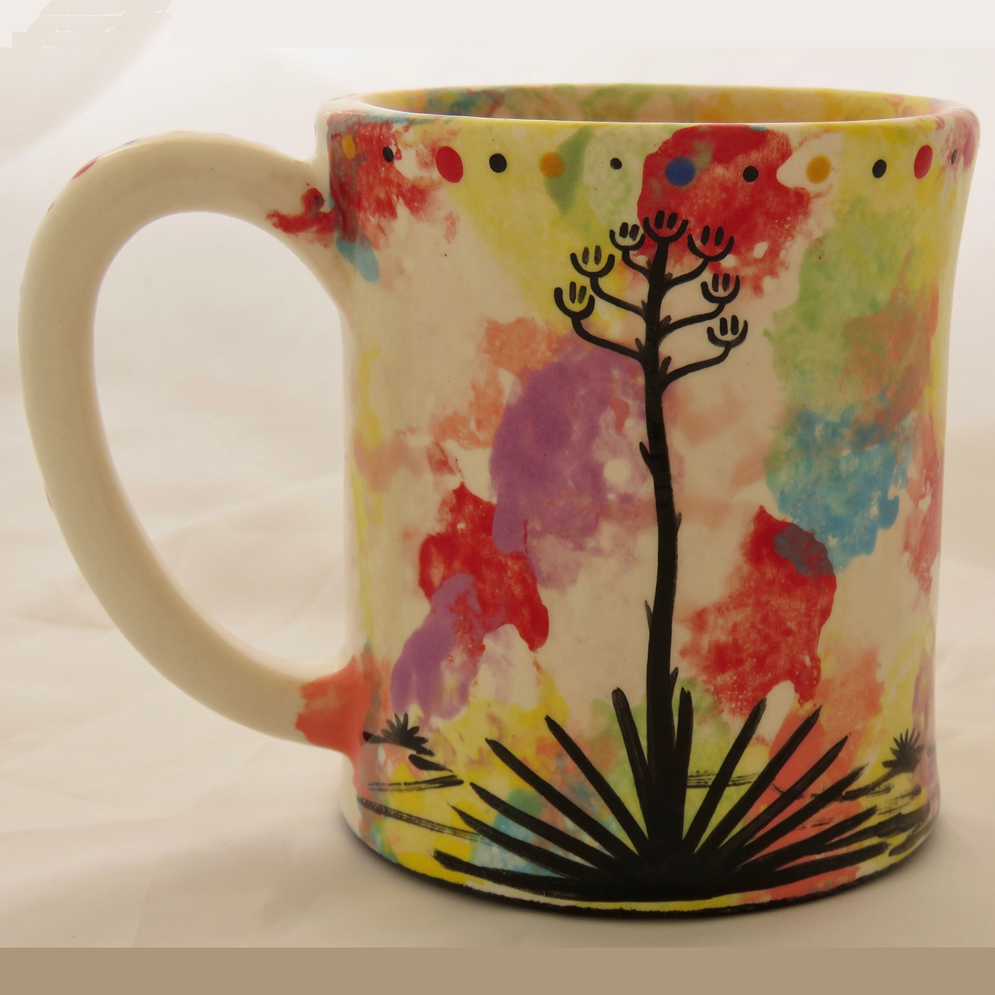 Mana Pottery emug featuring Peyote button on one side and desert vegetation on reverse, on white