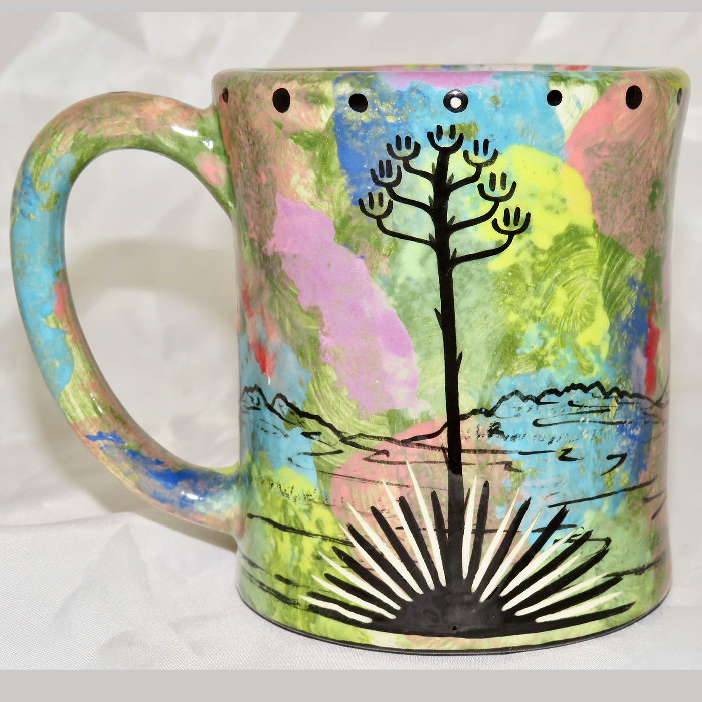 Mana Pottery e-mug featuring Arizona jackrabbit and desert landscape on reverse sides, on green background.