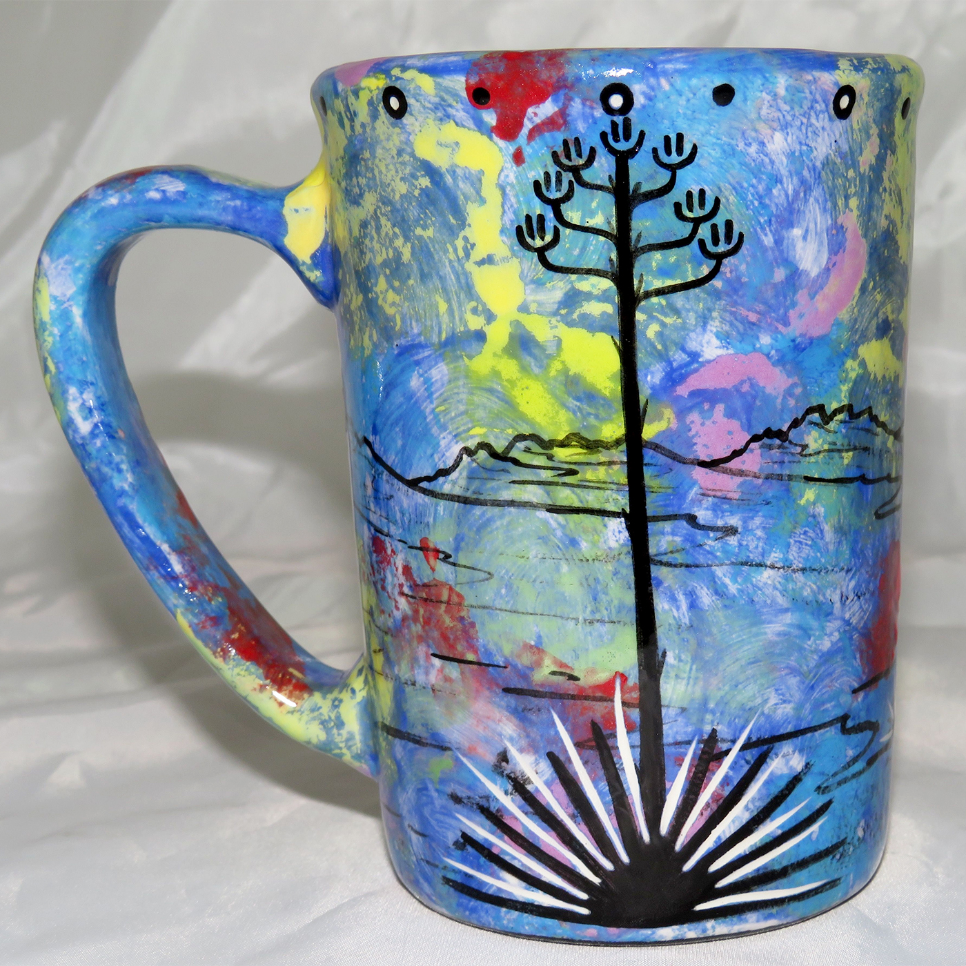 Mana Pottery Large Mug featuring bear and desert landscape on reverse sides, on blue background.