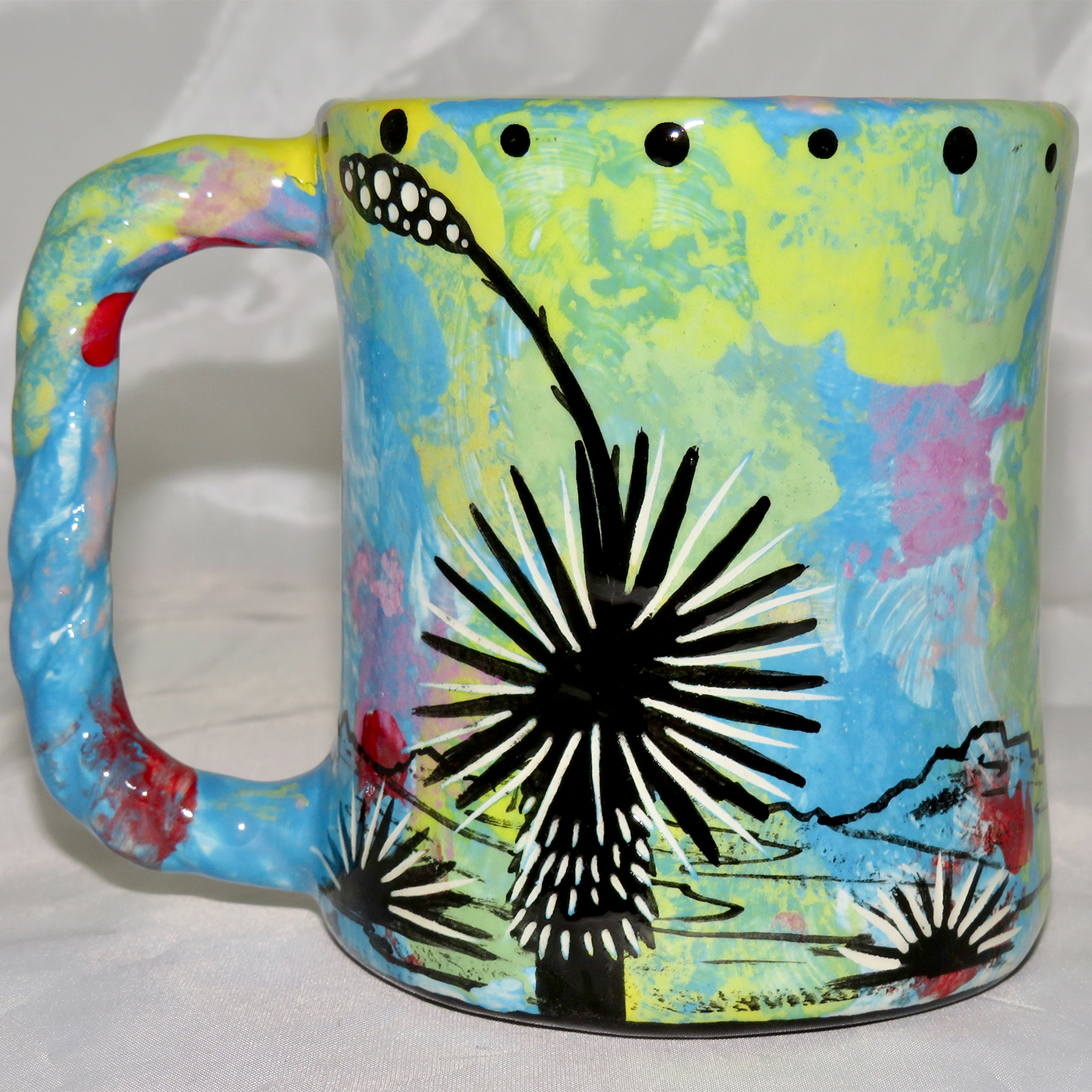 Mana Pottery Rope Mug featuring hawk in flight on one side and desert vegetation on reverse.