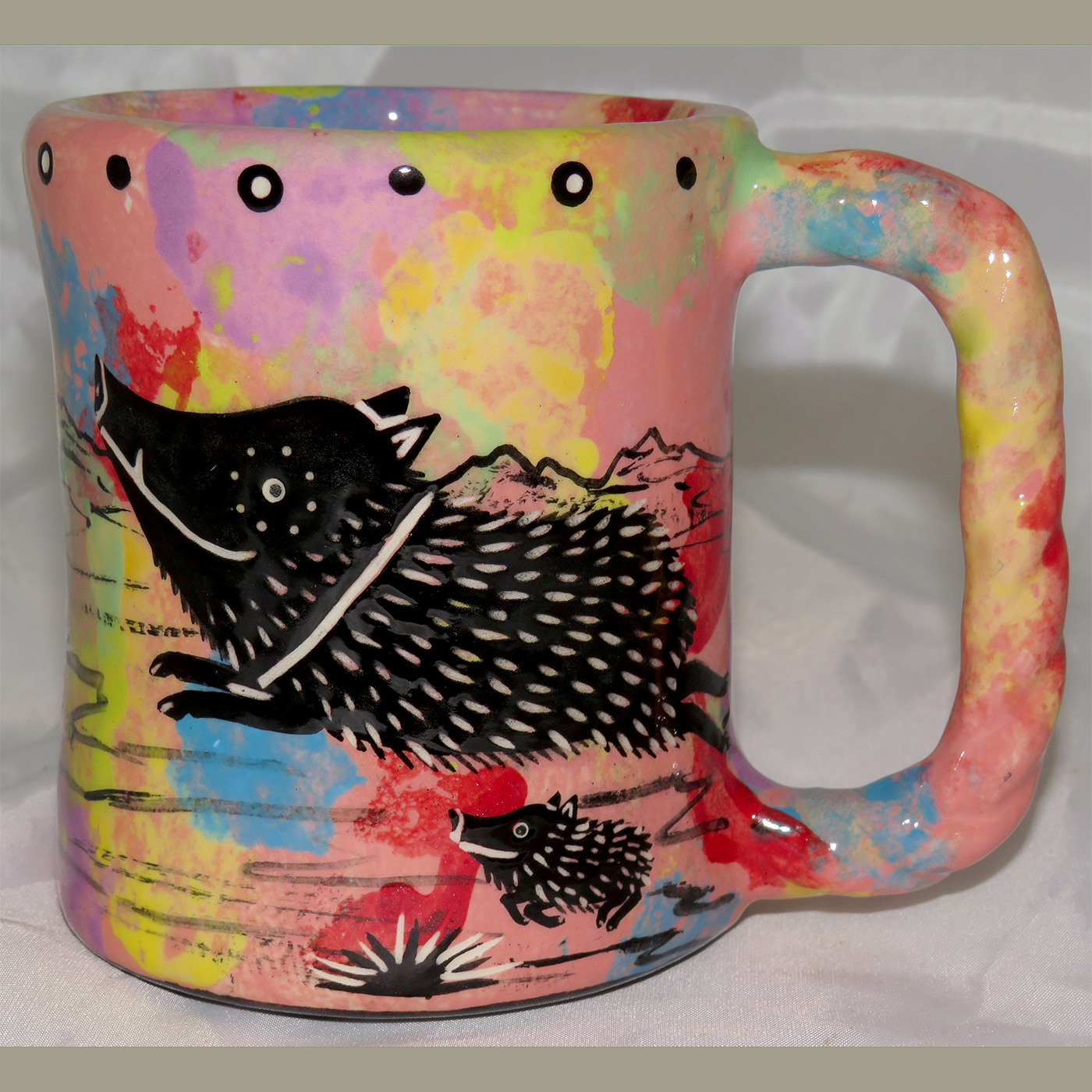 Mana Pottery Rope Mug featuring javelina on one side and desert vegetation on reverse.
