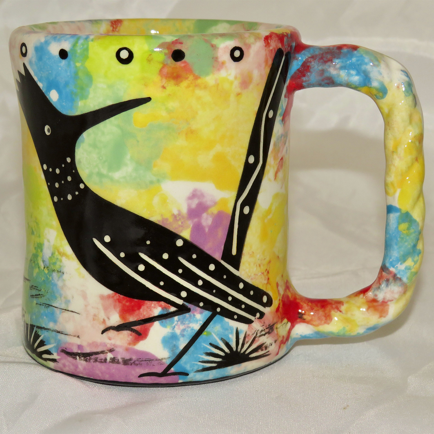 Mana Pottery Rope Mug featuring roadrunner on one side and desert vegetation on reverse.