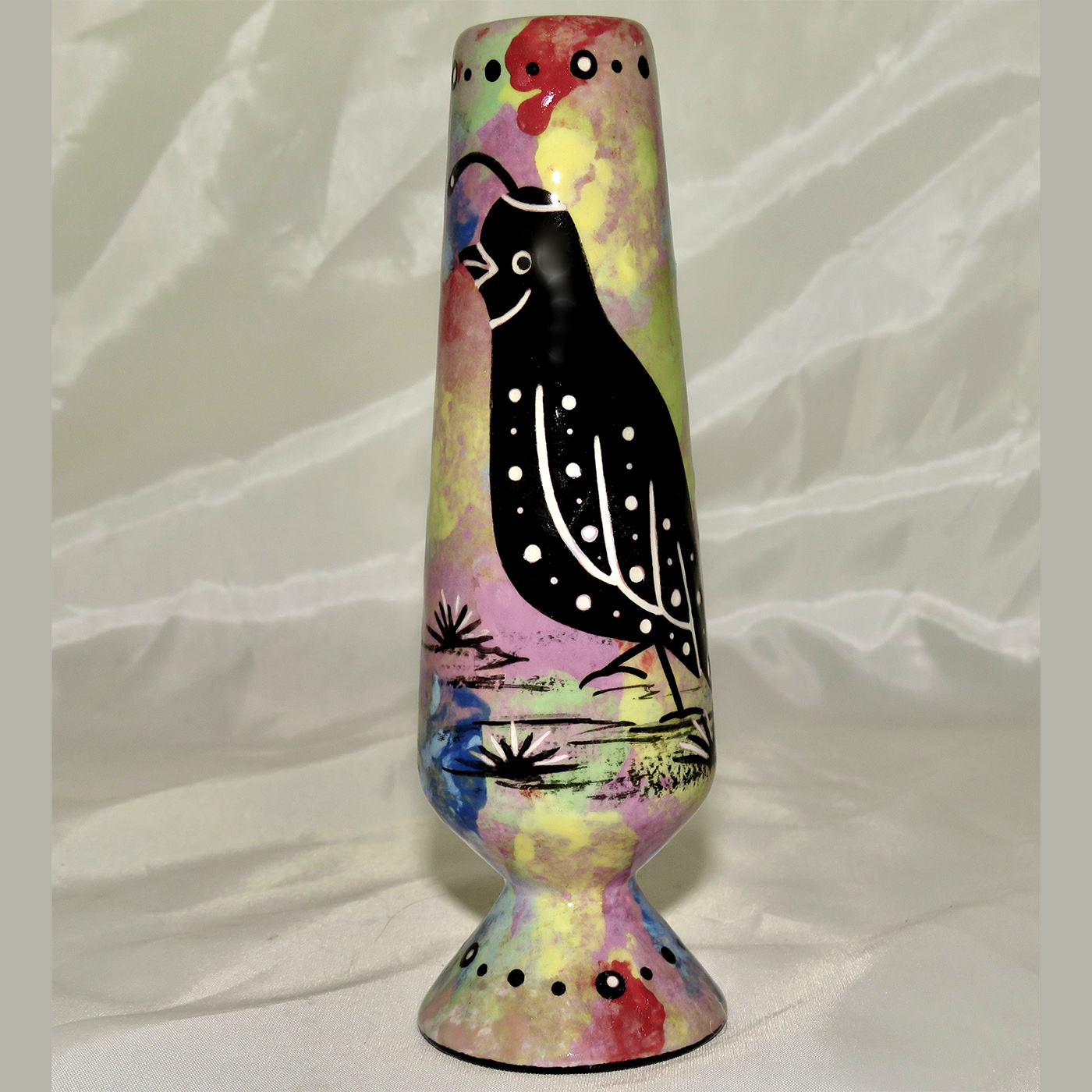 Mana Pottery bud vase featuring quail with schematic design on reverse, on purple accented background.