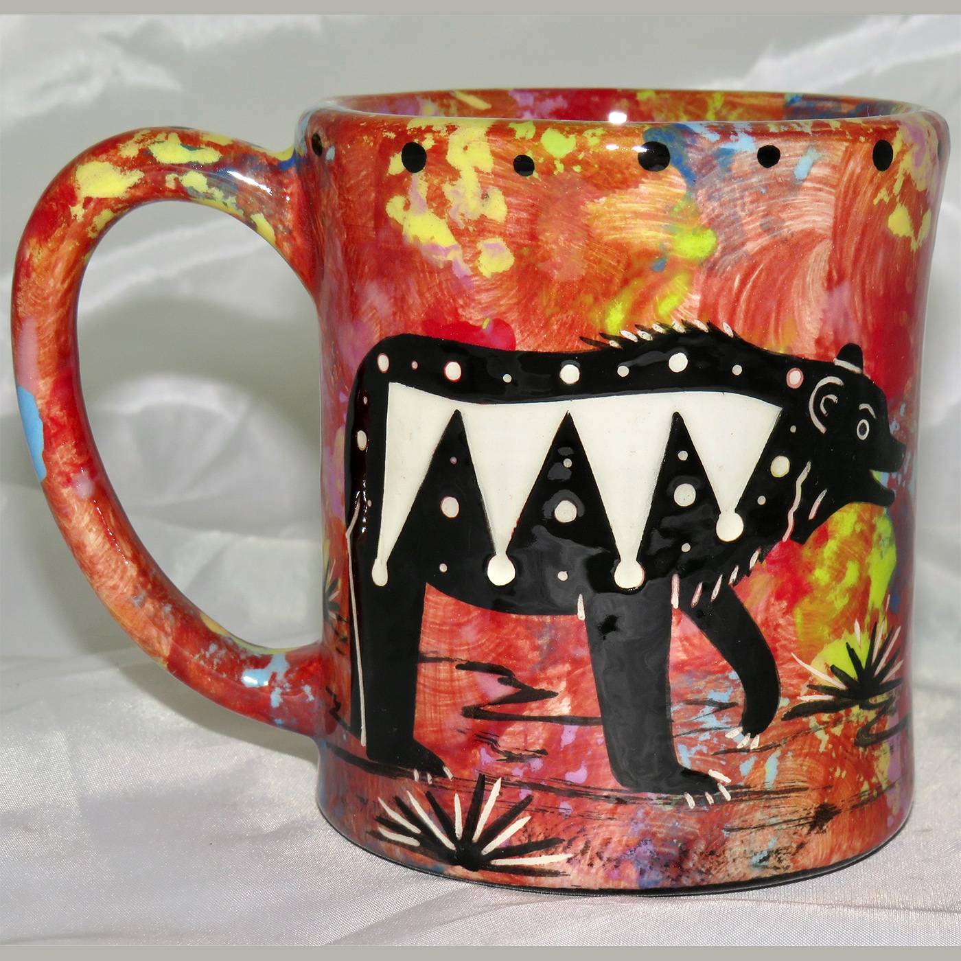 Mana Pottery e-mug featuring bear with desert landscape on reverse.