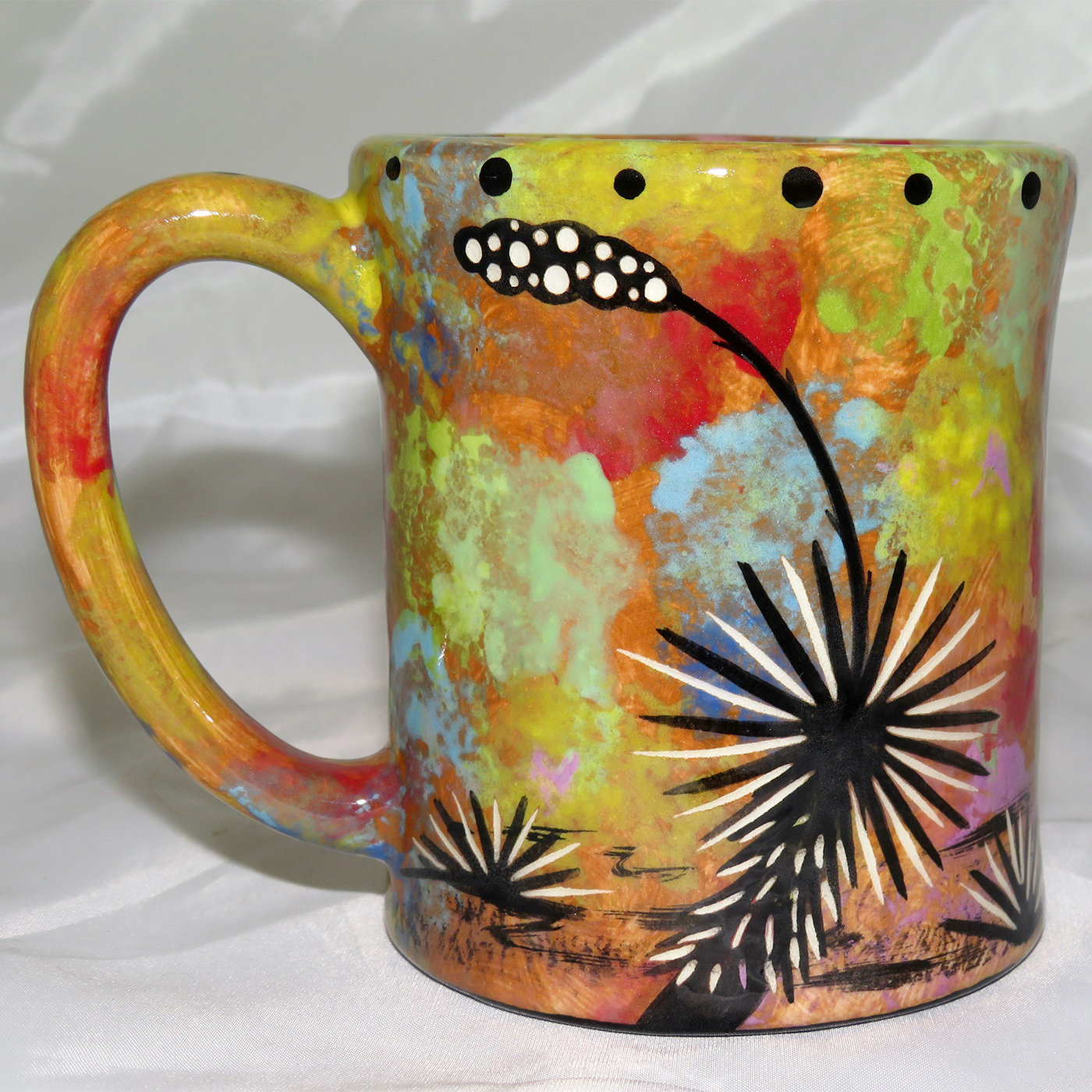 Mana Pottery e-mug featuring kokopelli and desert landscape on reverse