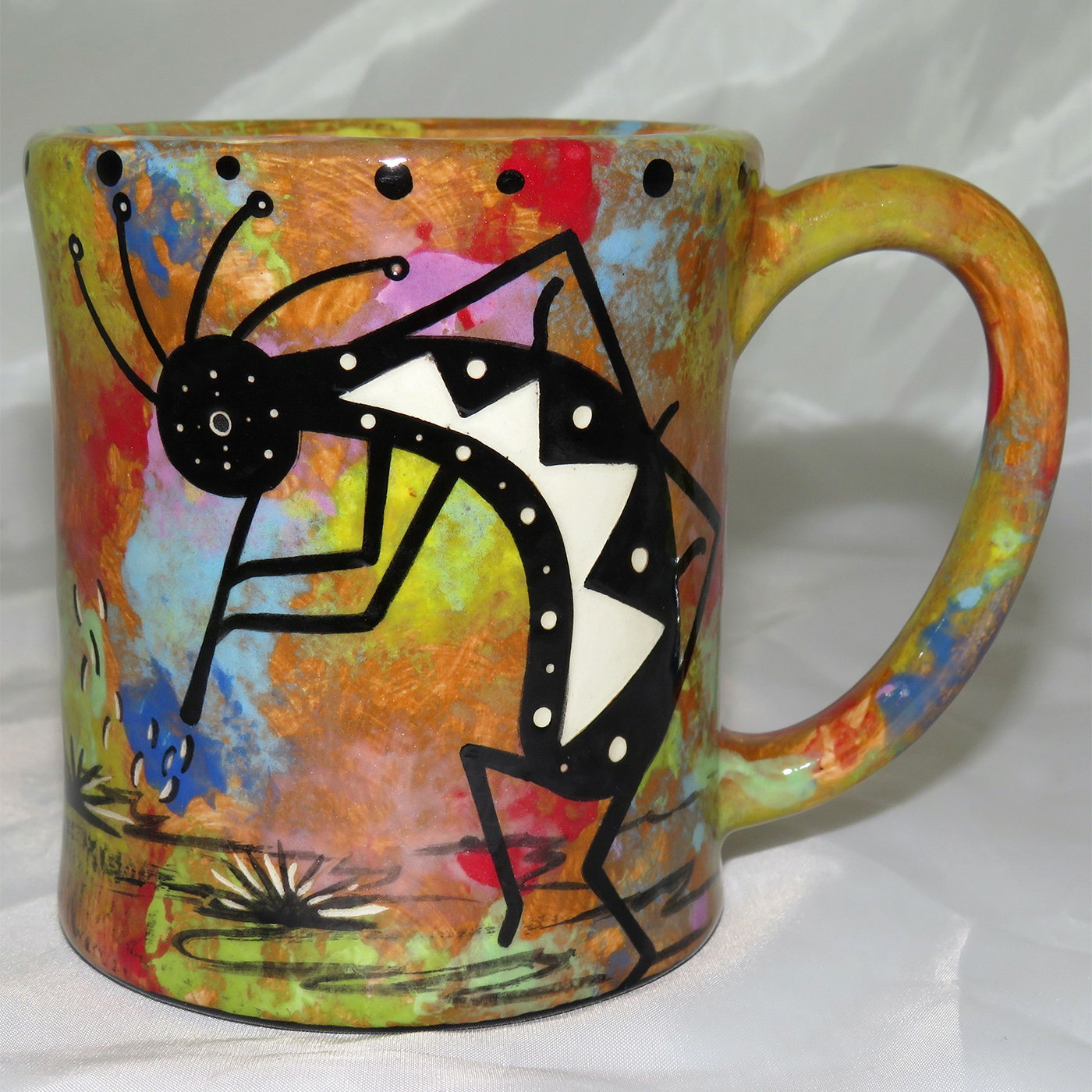 Mana Pottery e-mug featuring kokopelli and desert landscape on reverse