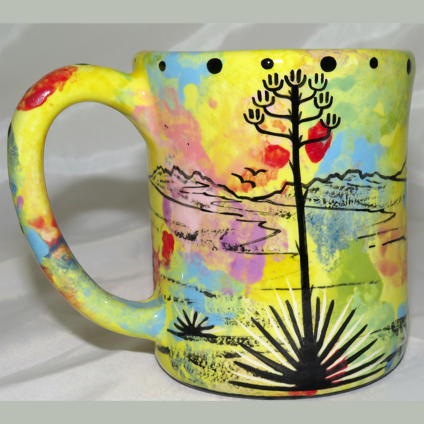 Mana Pottery e-mug featuring roadrunner and desert landscape on reverse.