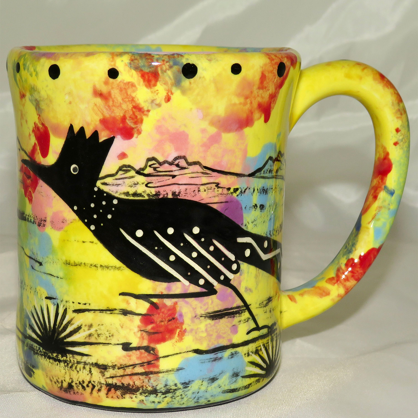 Mana Pottery e-mug featuring roadrunner and desert landscape on reverse.