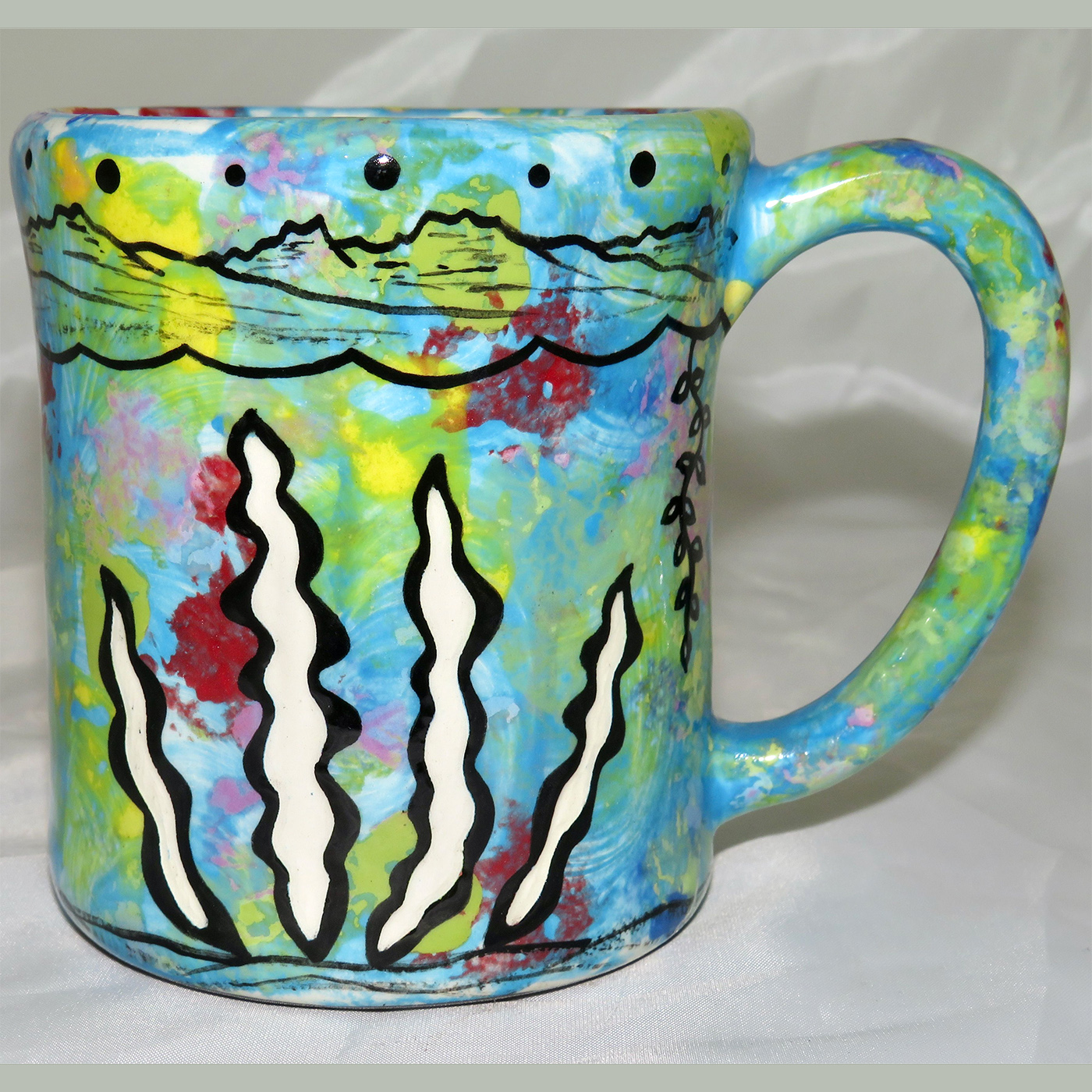 Mana Pottery e-mug featuring salmon with underwater-scape on reverse.