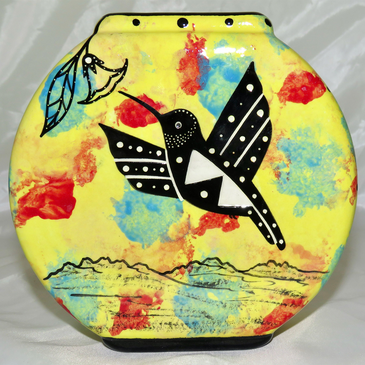 Mana Pottery pillow vase featuring hummingbird with desert landscape on reverse.
