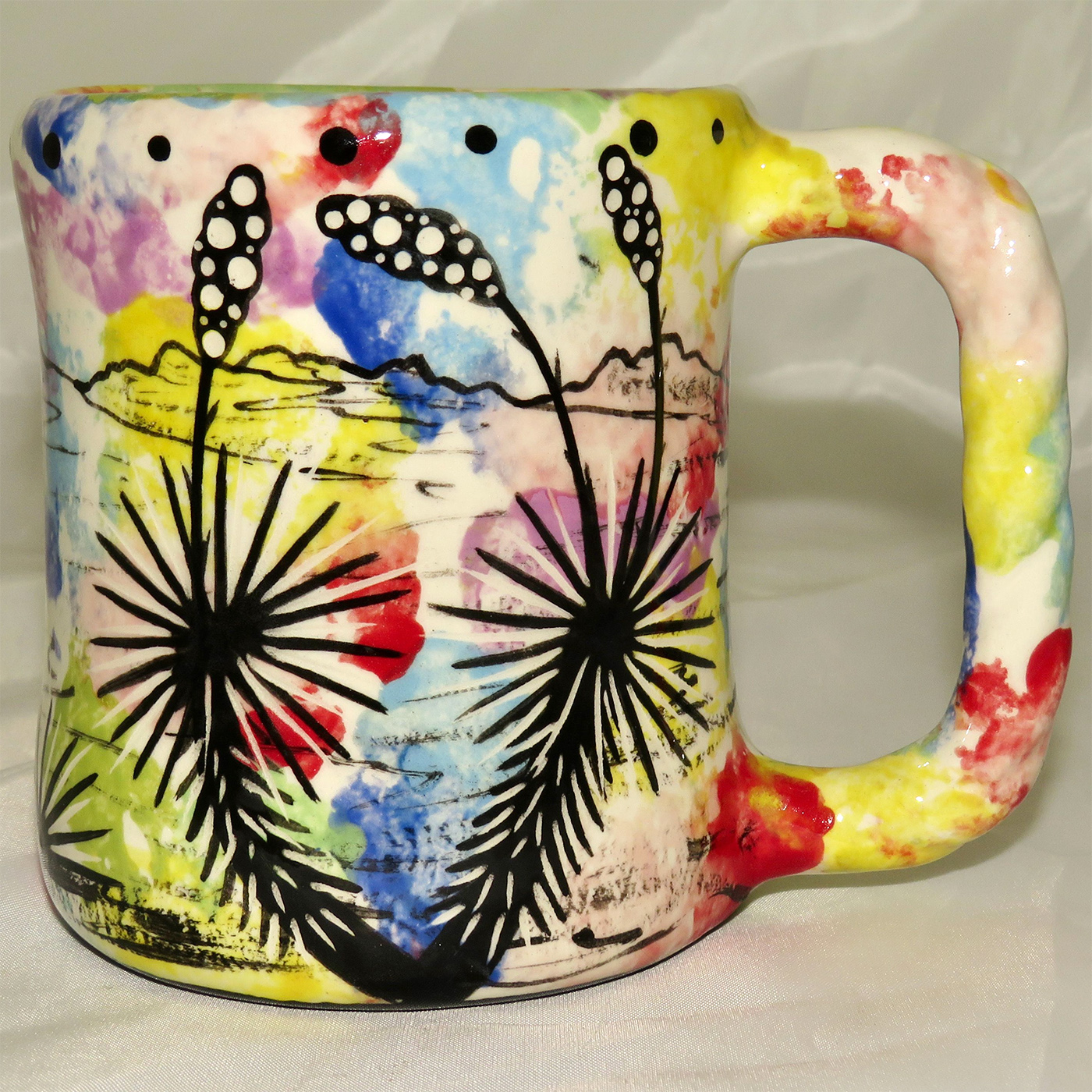 Mana Pottery rope mug featuring bear and desert landscape on reverse.