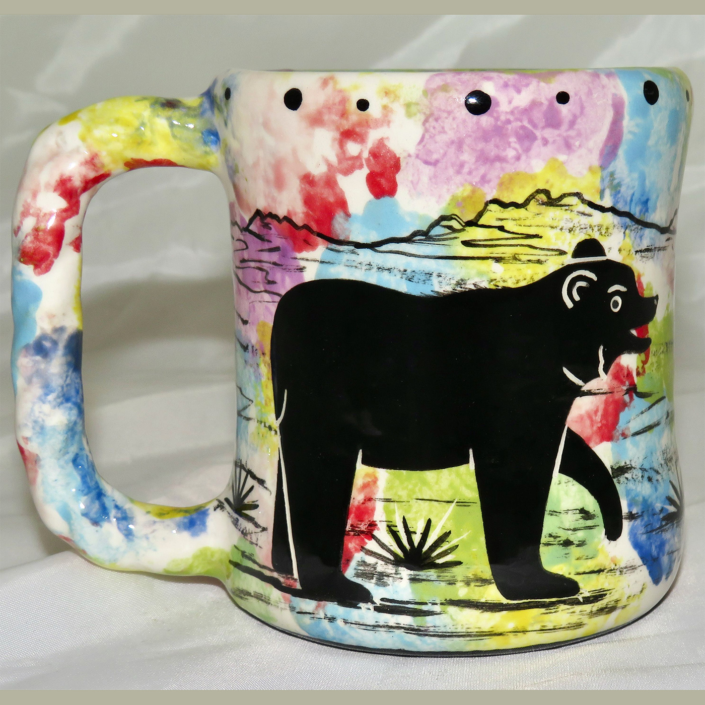 Mana Pottery rope mug featuring bear and desert landscape on reverse.