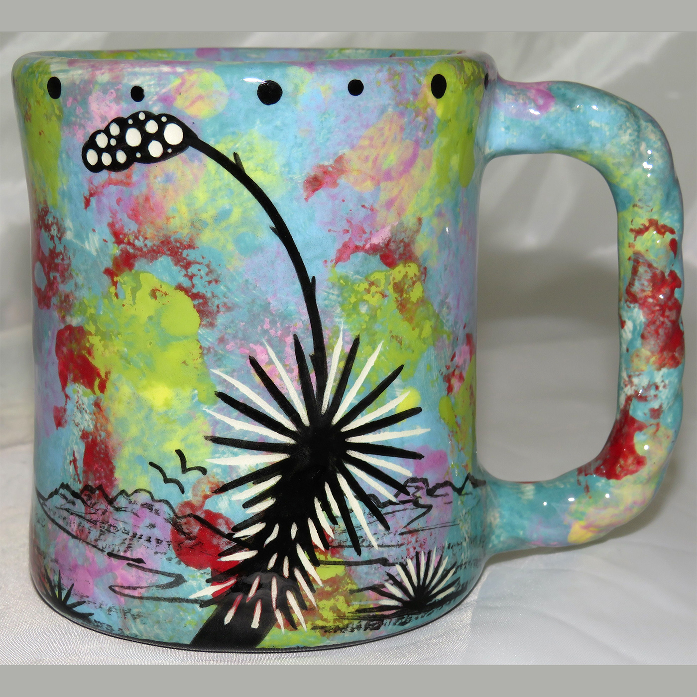 Mana Pottery rope mug featuring hawk in flight and desert landscape on reverse.