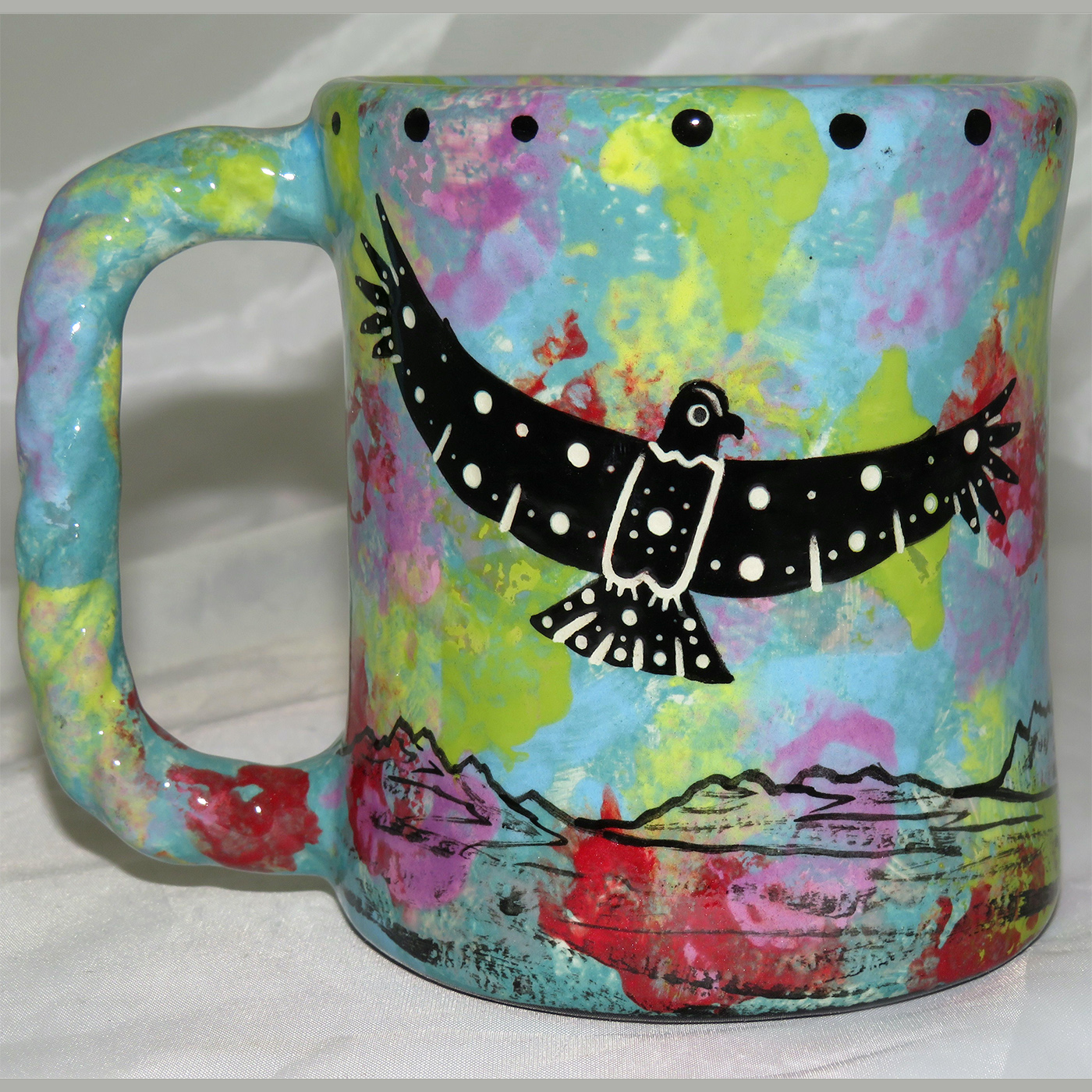 Mana Pottery rope mug featuring hawk in flight and desert landscape on reverse.