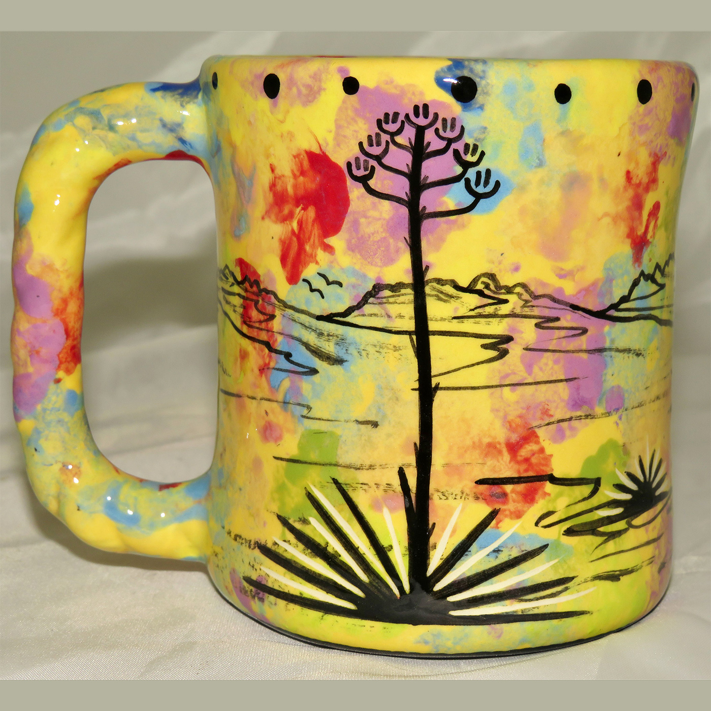 Mana Pottery rope mug featuring deer and desert landscape on reverse.