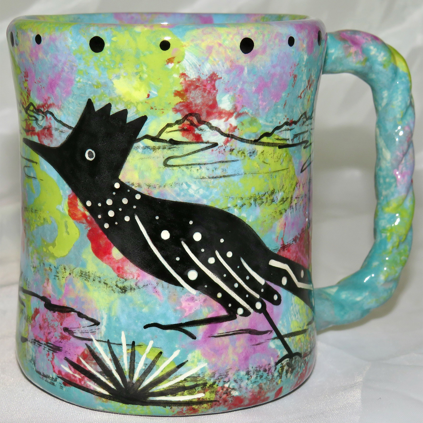Mana Pottery rope mug featuring roadrunner and desert landscape on reverse.