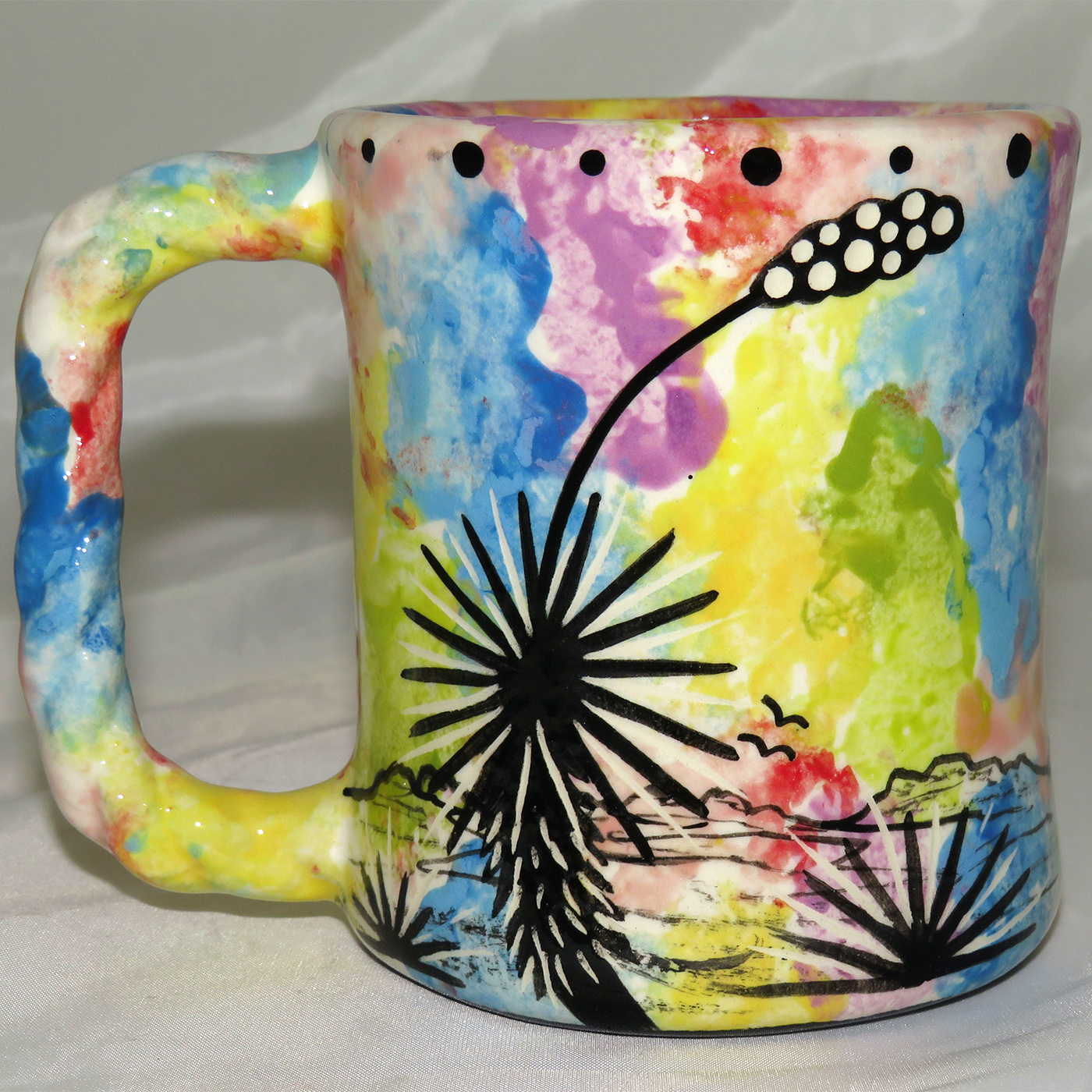 Mana Pottery rope mug featuring turtle and desert landscape on reverse.