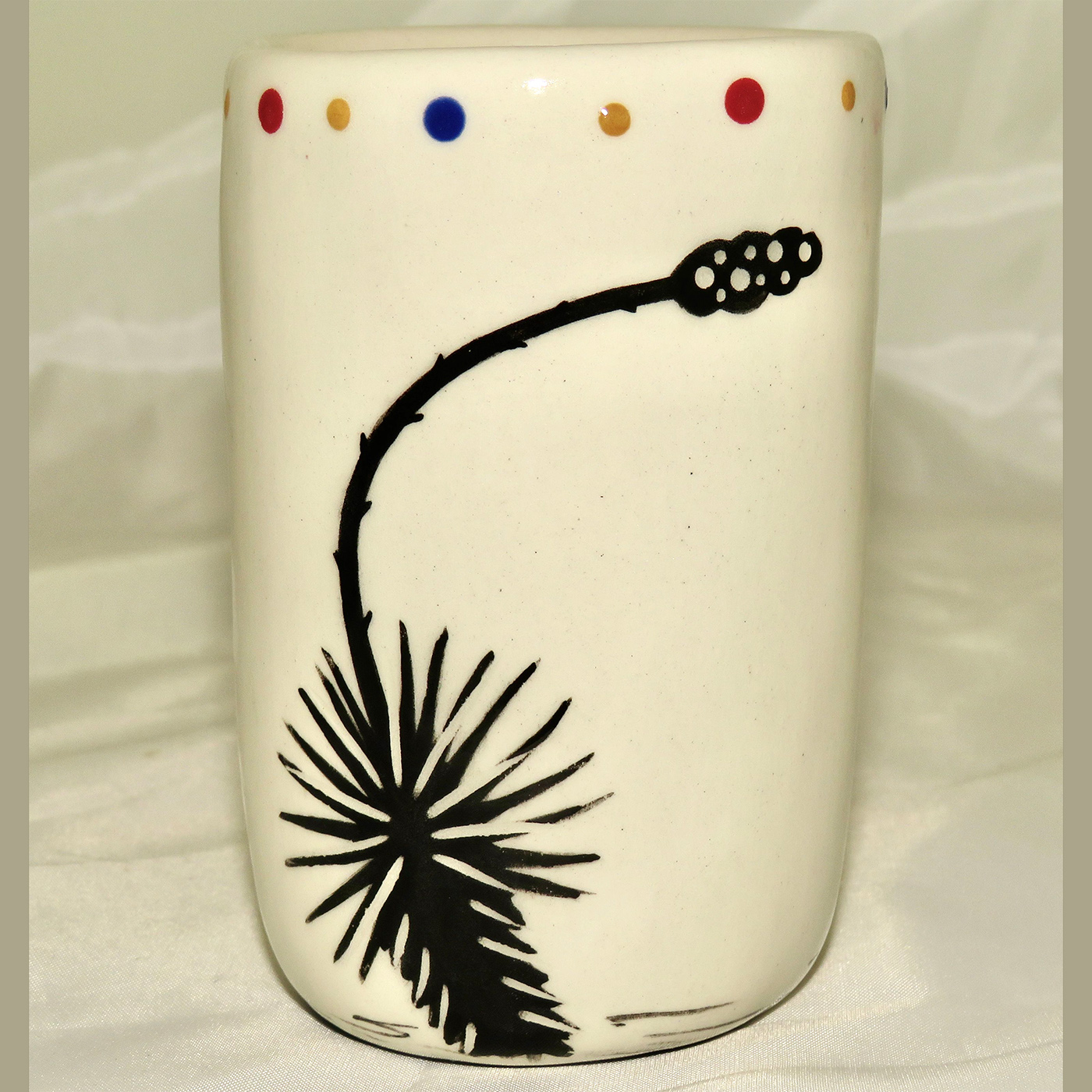 Mana Pottery clay pottery shot glass featuring Peyote button on one side and desert plant on reverse.