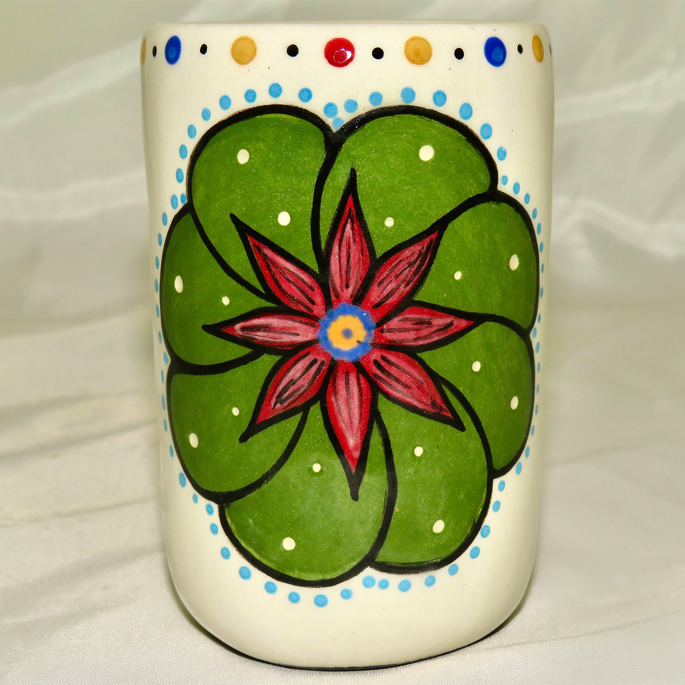 Mana Pottery clay pottery shot glass featuring Peyote button on one side and desert plants on reverse.