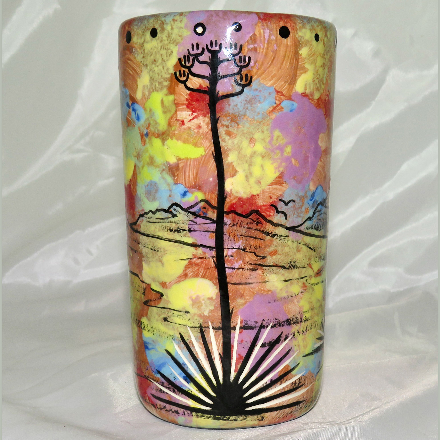Mana Pottery tumbler featuring coyote and desert landscape on reverse.