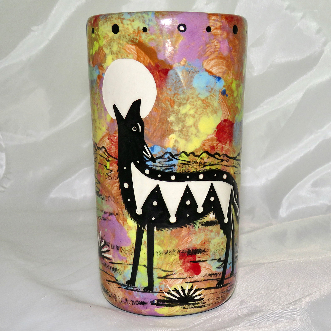 Mana Pottery tumbler featuring coyote and desert landscape on reverse.