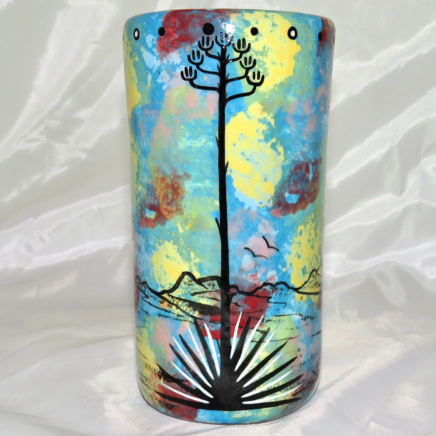 Mana Pottery tumbler featuring hawk and desert landscape on reverse.
