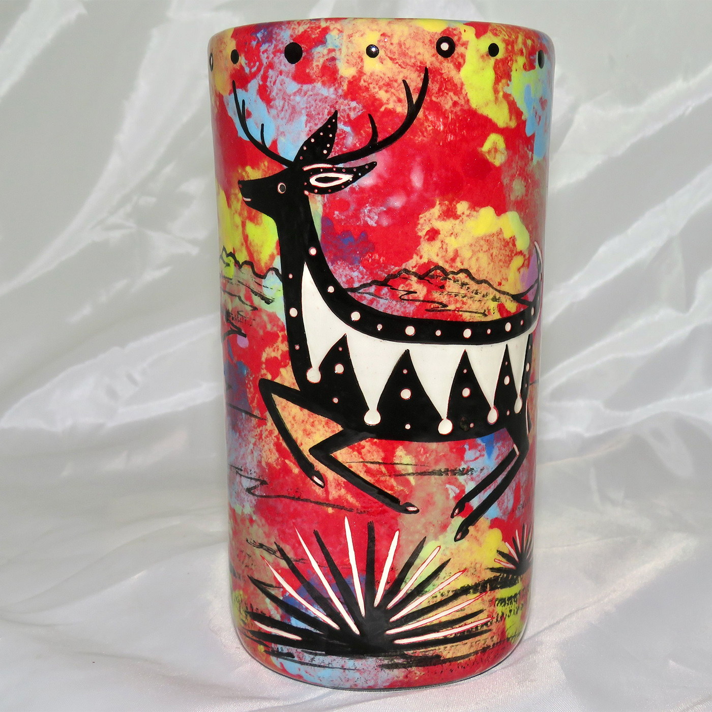 Mana Pottery tumbler featuring deer and desert landscape on reverse.