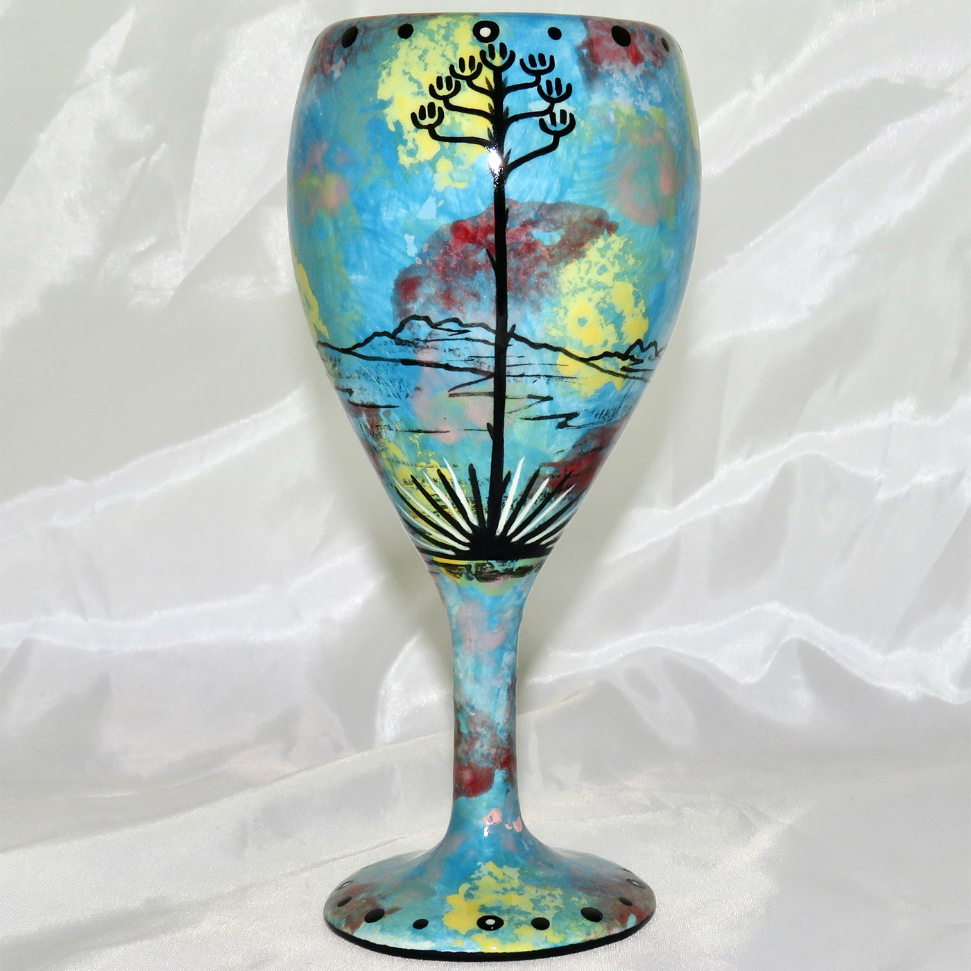 Mana Pottery wine glass featuring hawk in flight with desert landscape on reverse.