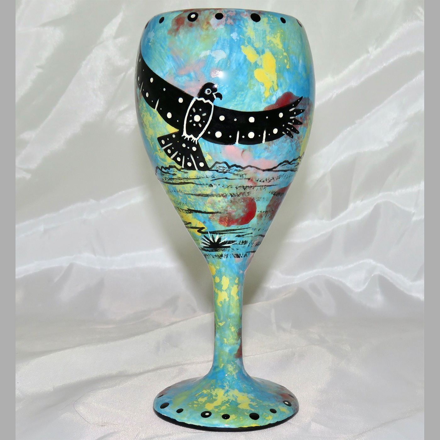 Mana Pottery wine glass featuring hawk in flight with desert landscape on reverse.