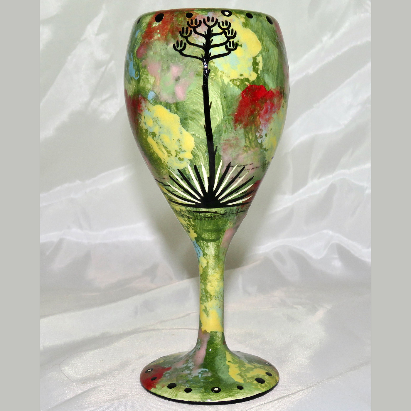 Mana Pottery wine glass featuring toad with desert landscape on reverse.