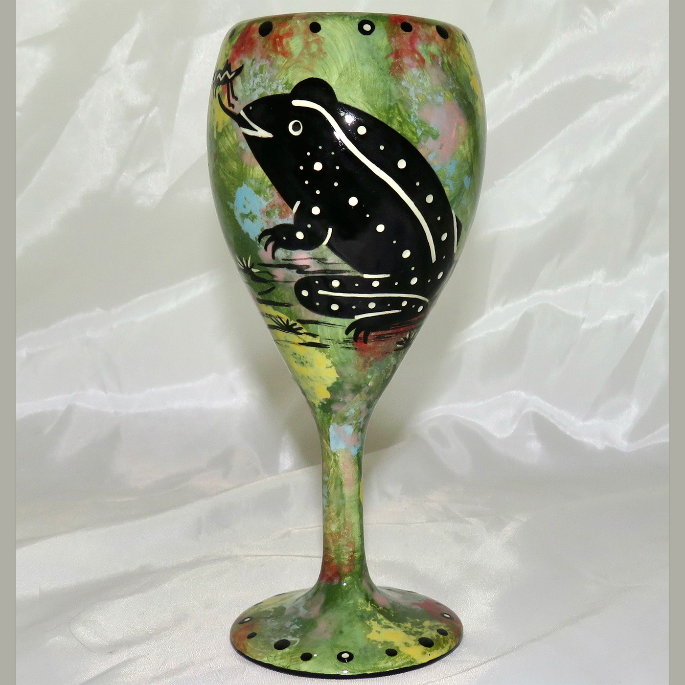 Mana Pottery wine glass featuring toad with desert landscape on reverse.