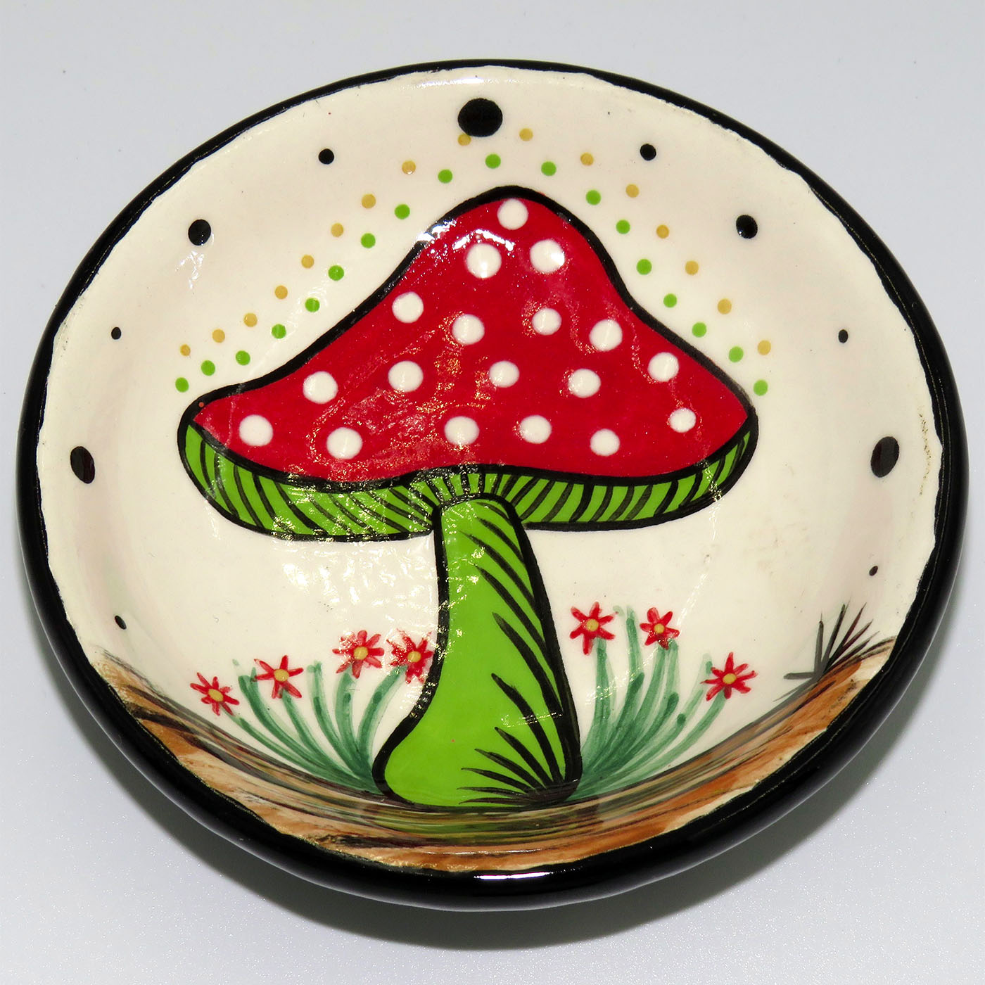 Mana Pottery teabag holder featuring radiating Amanita mushroom.