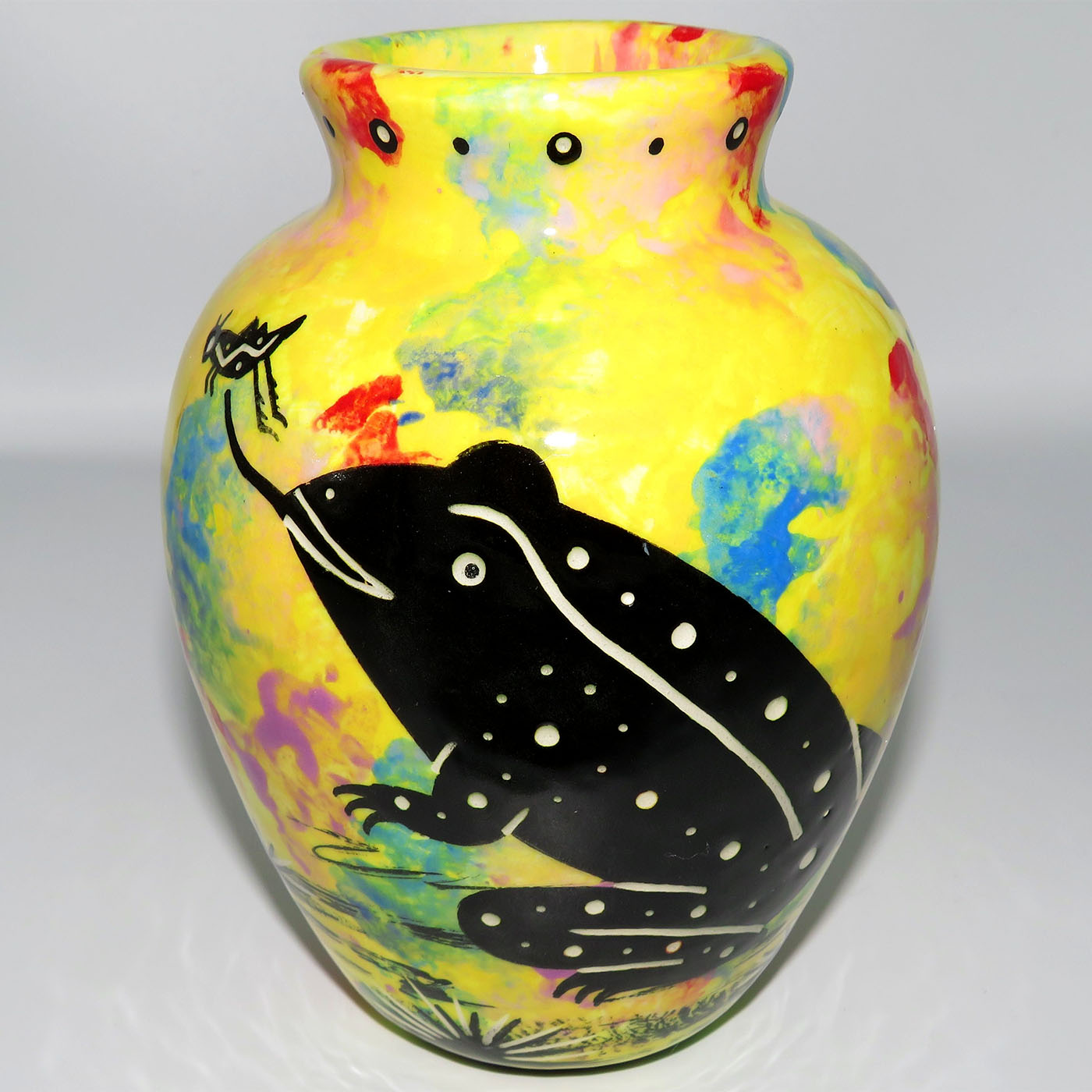Six inch vase featuring toad and desert landscape on reverse sides, on a bright yellow background.