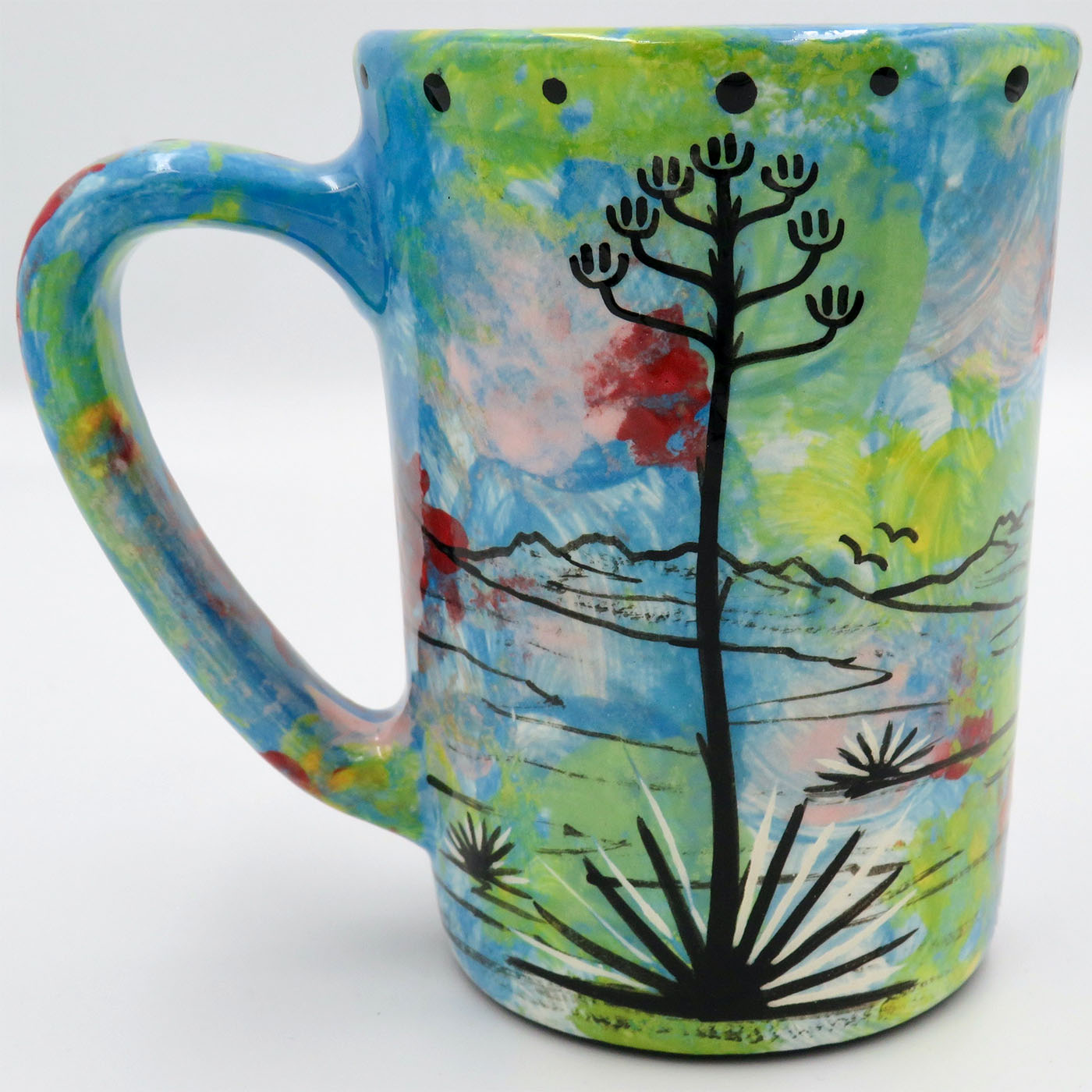 Mana Pottery large mug featuring owl and desert landscape on reverse sides, on turquoise blue background.