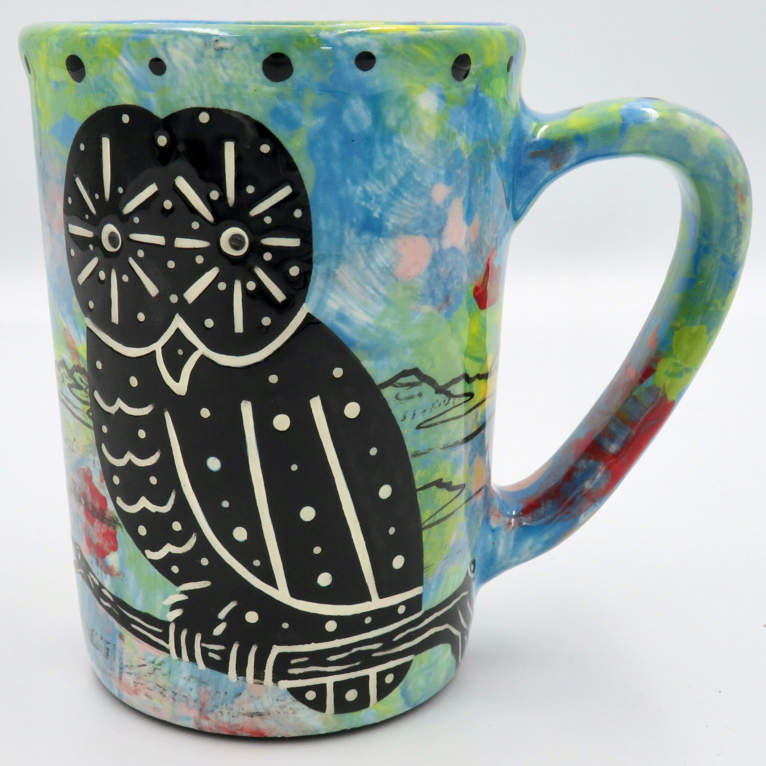 Mana Pottery large mug featuring owl and desert landscape on reverse sides, on turquoise blue background.