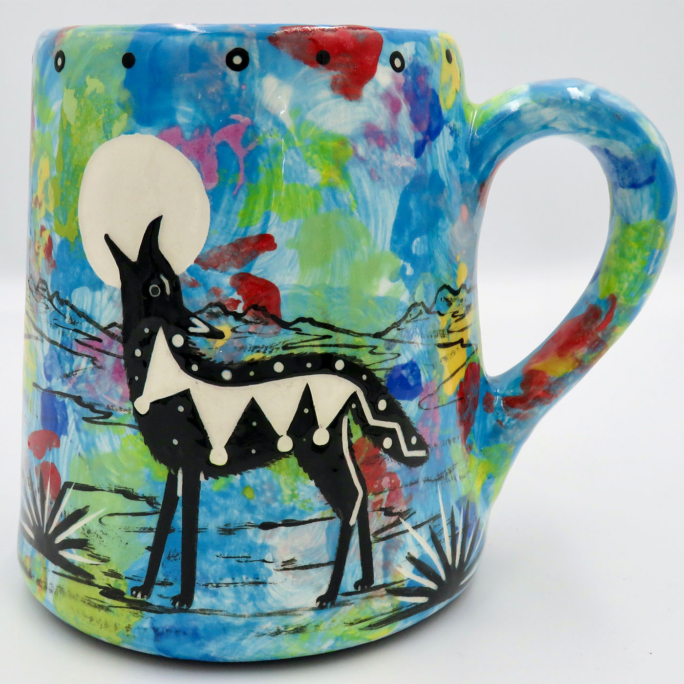 Mana Pottery extra large mug featuring coyote and desert landscape on reverse sides, on turquoise blue.