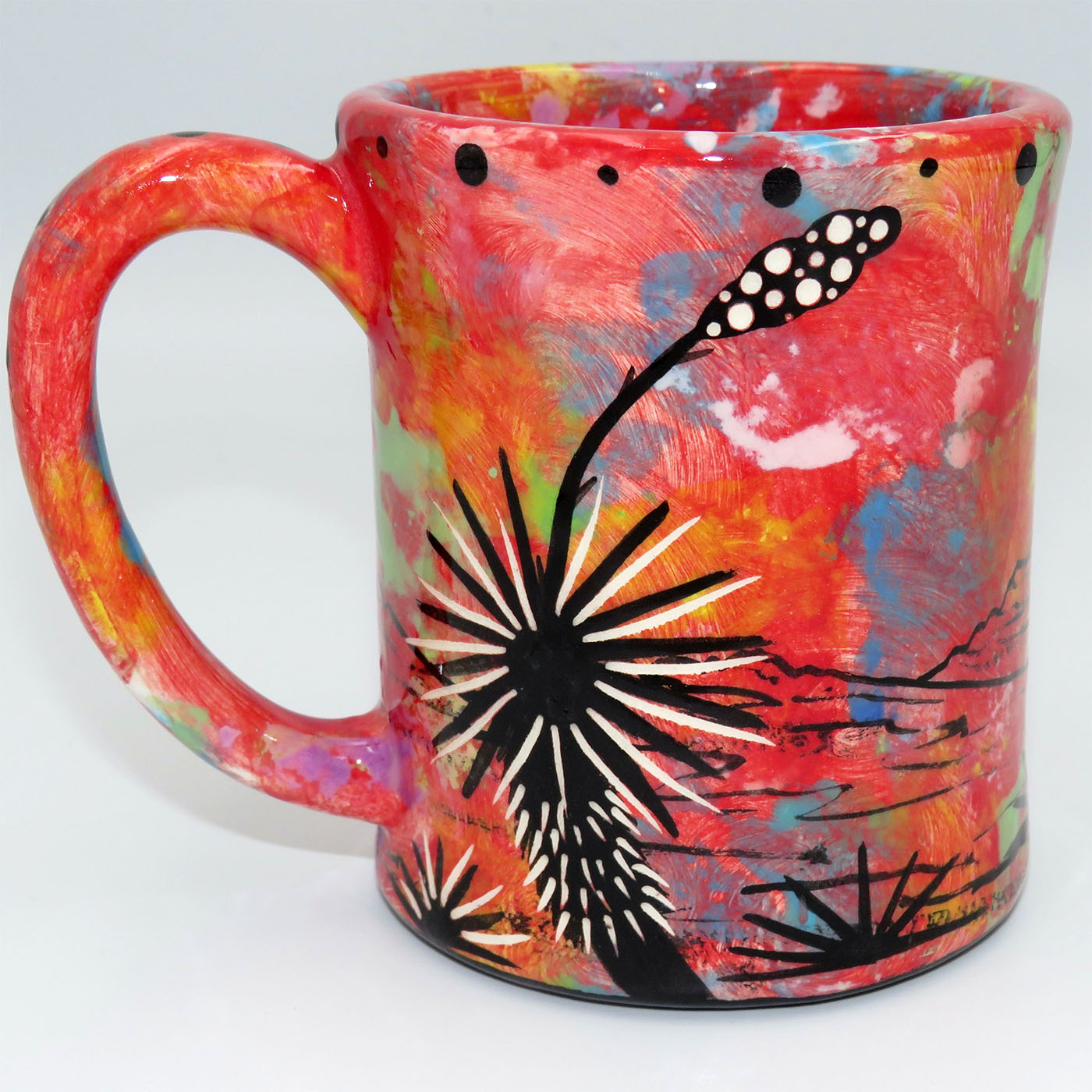 Mana Pottery e-mug featuring hummingbird and desert landscape on crimson background.