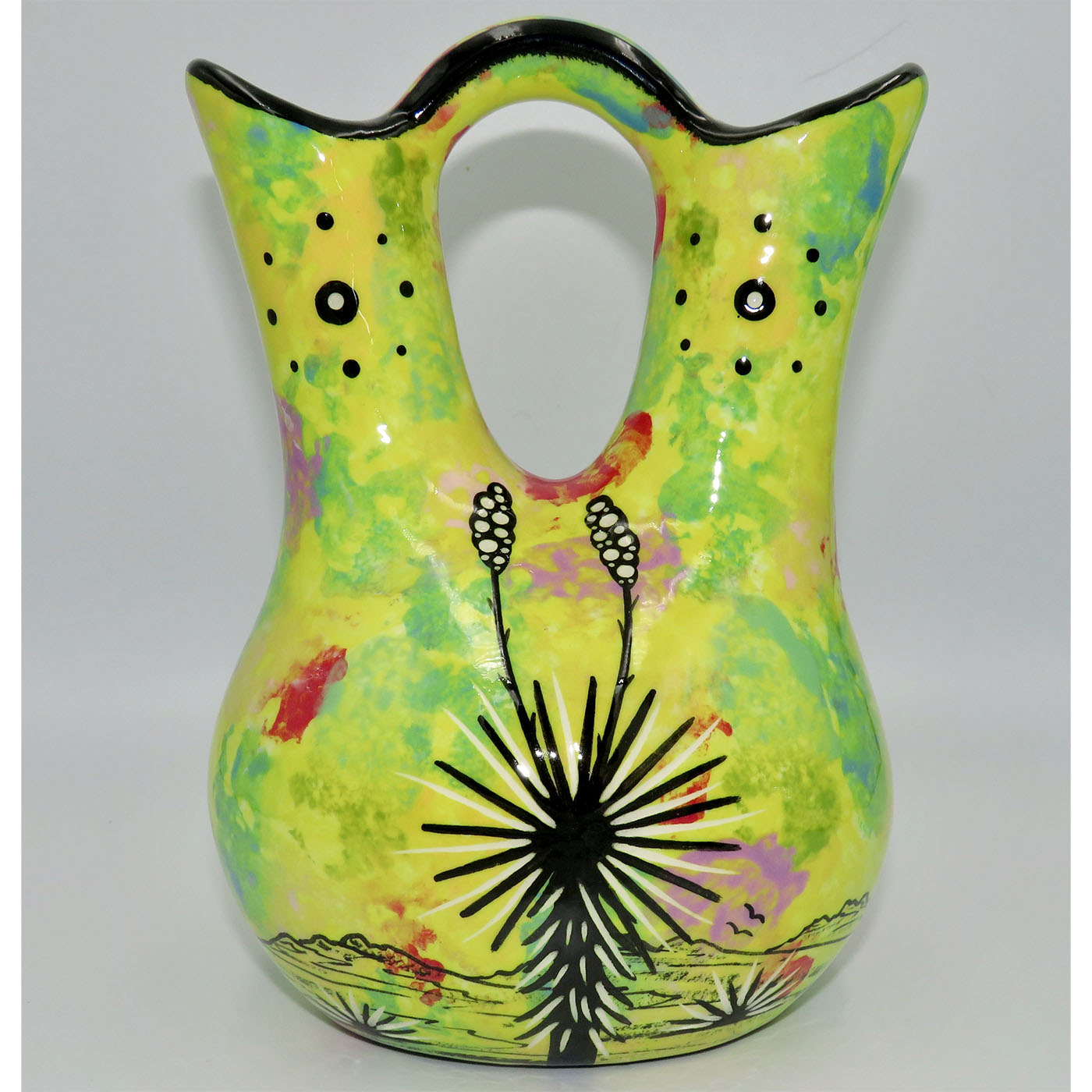 Mana Pottery medium wedding vase featuring kissing hummingbirds and desert landscape on bright yellow background