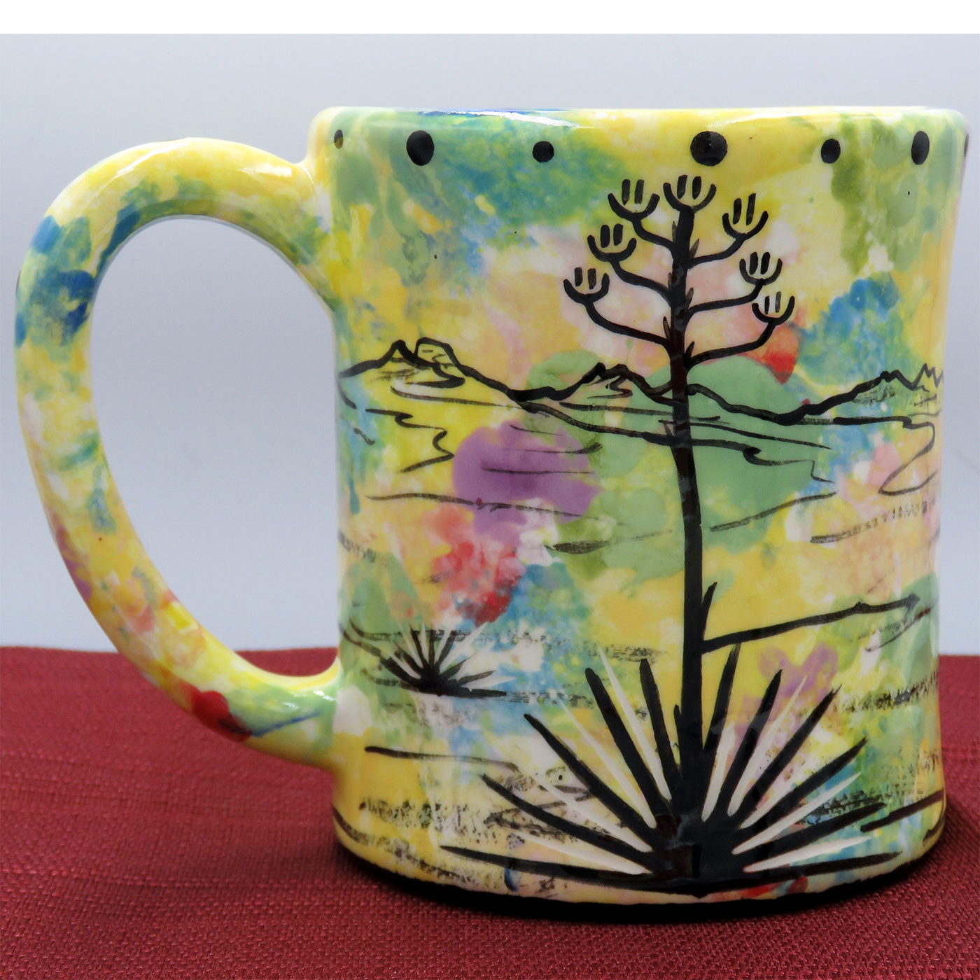 Mana Pottery e-mug featuring Javelina and baby on desert landscape on confetti
